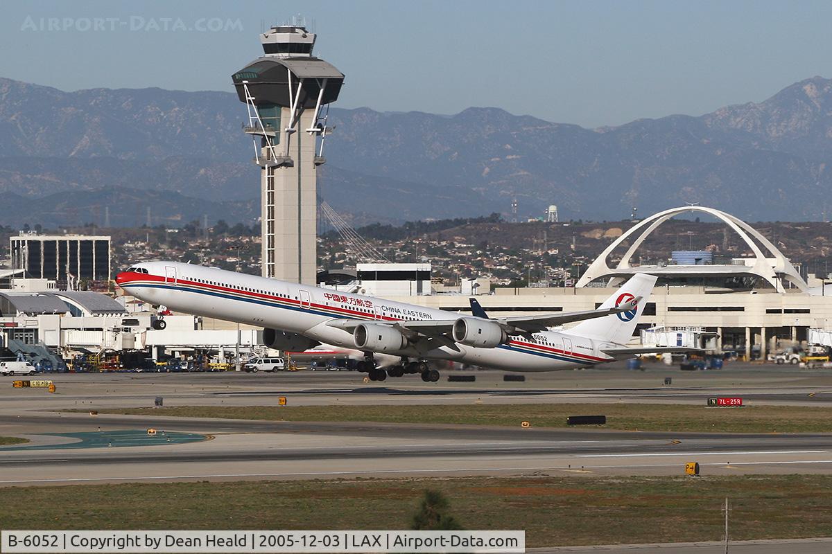 B-6052, 2003 Airbus A340-642 C/N 514, China Eastern B-6052 departing LAX RWY 25R on a clear December day.