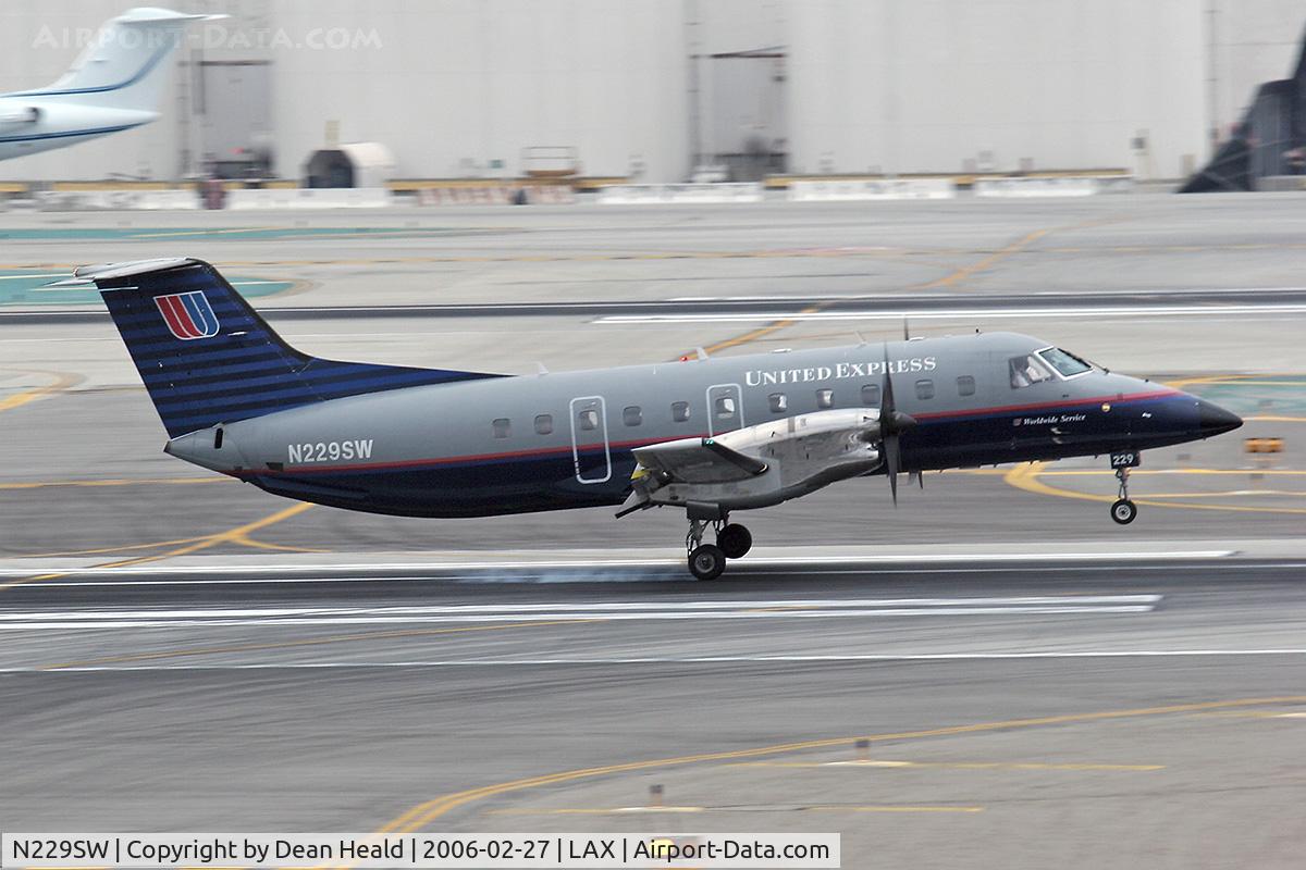 N229SW, 1995 Embraer EMB-120ER Brasilia C/N 120.305, United Express N229SW touching down on RWY 7R at LAX.