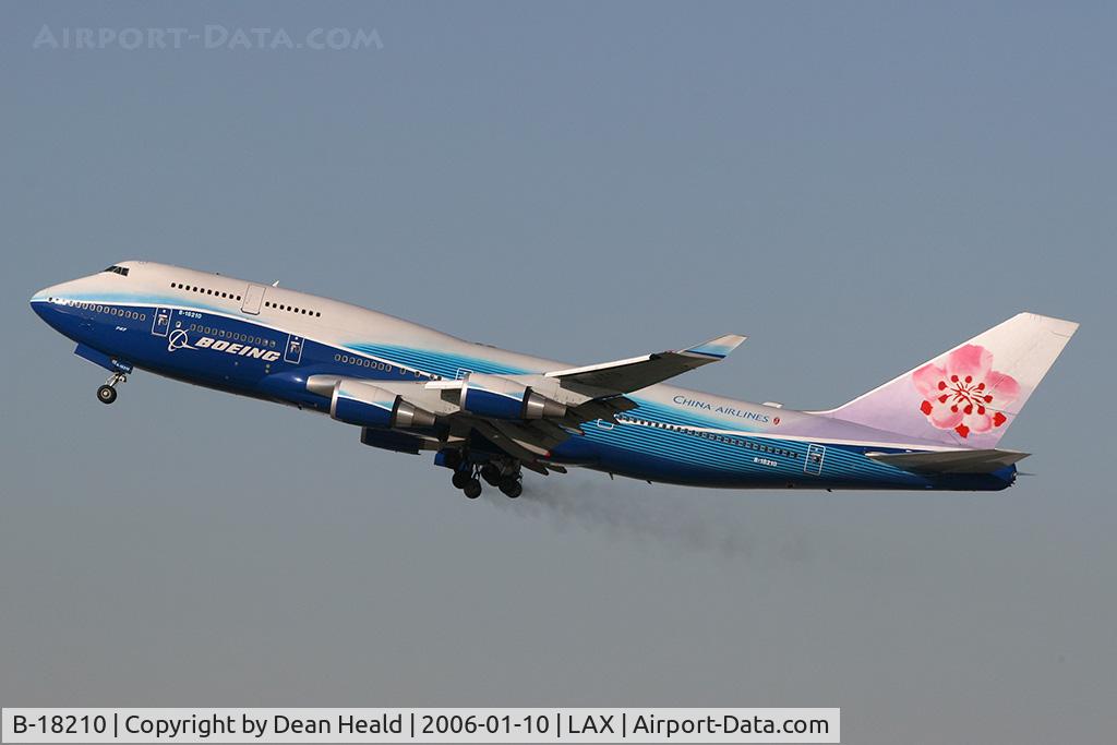 B-18210, 2004 Boeing 747-409 C/N 33734, China Airlines B-18210 departing RWY 25R.  Note the brake dust trailing from the main landing gear.