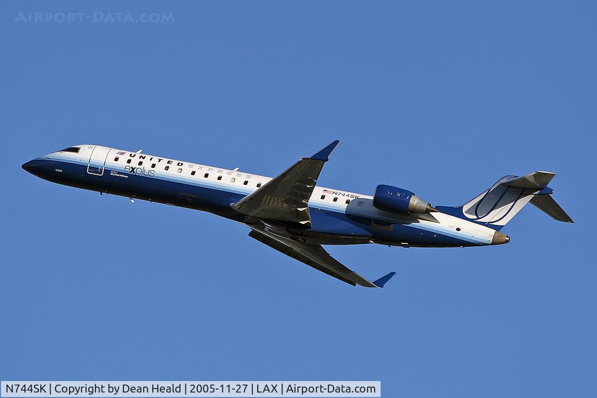 N744SK, 2005 Bombardier CRJ-701 (CL-600-2C10) Regional Jet C/N 10200, United Express N744SK sporting new colors, departing LAX RWY 25R.