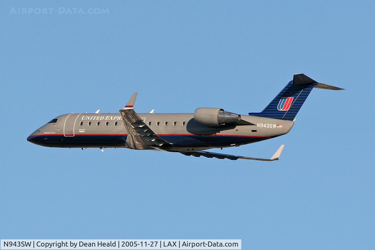 N943SW, 2003 Bombardier CRJ-200LR (CL-600-2B19) C/N 7762, United Express N943SW (CRJ-200) climbing out from LAX RWY 25R.