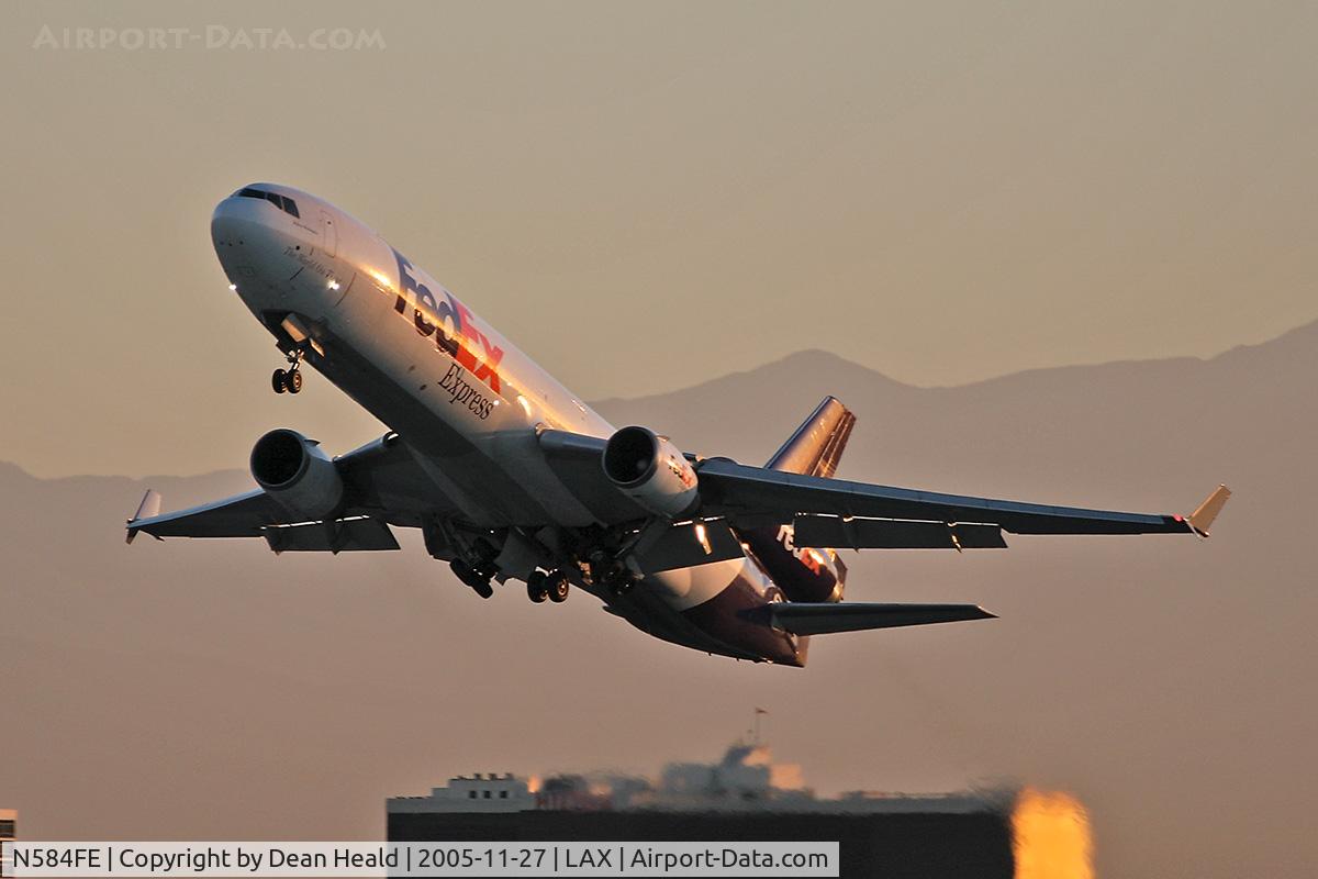 N584FE, 1992 McDonnell Douglas MD-11F C/N 48436, FedEX N584FE departing LAX RWY 25L on an early morning in November.