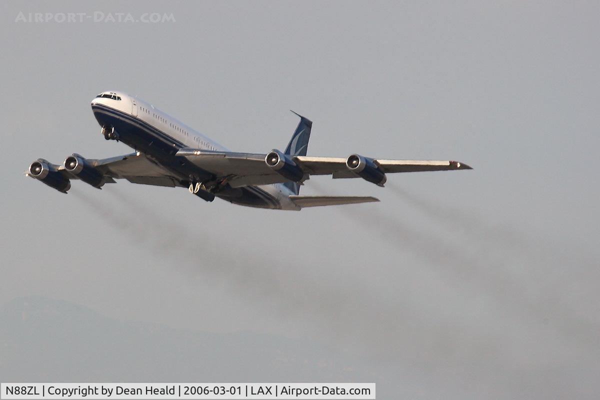 N88ZL, 1965 Boeing 707-330B C/N 18928, N88ZL climbing out from LAX RWY 25R trailing smoke from her engines.