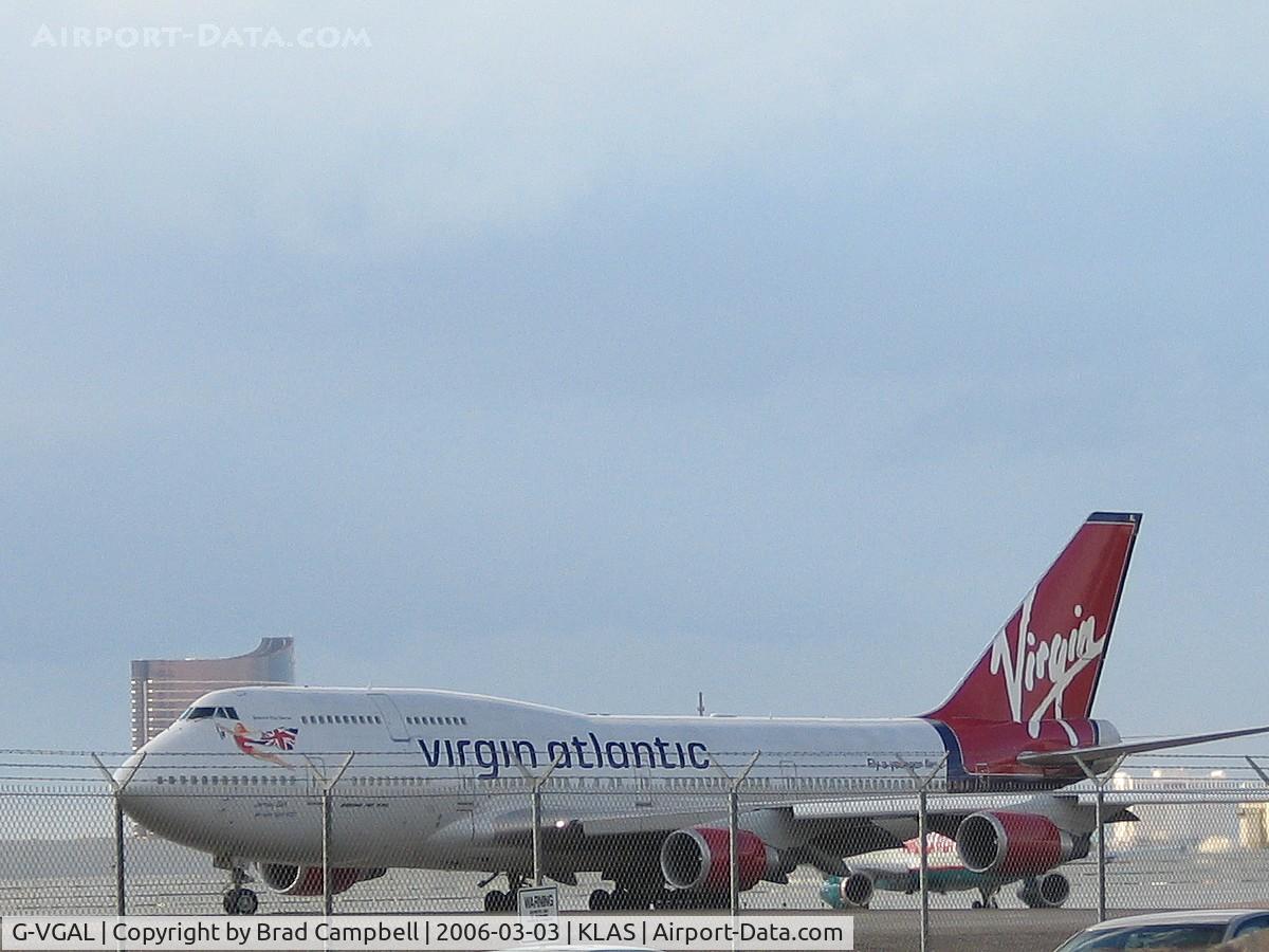 G-VGAL, 2001 Boeing 747-443 C/N 32337, 'Jersey Girl' - Too bad it was taxing for take-off and on the wrong side of the fence.