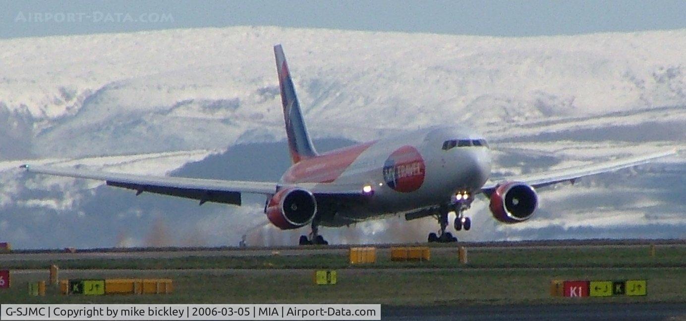 G-SJMC, 1994 Boeing 767-31K C/N 27205, touchdown on a winters day