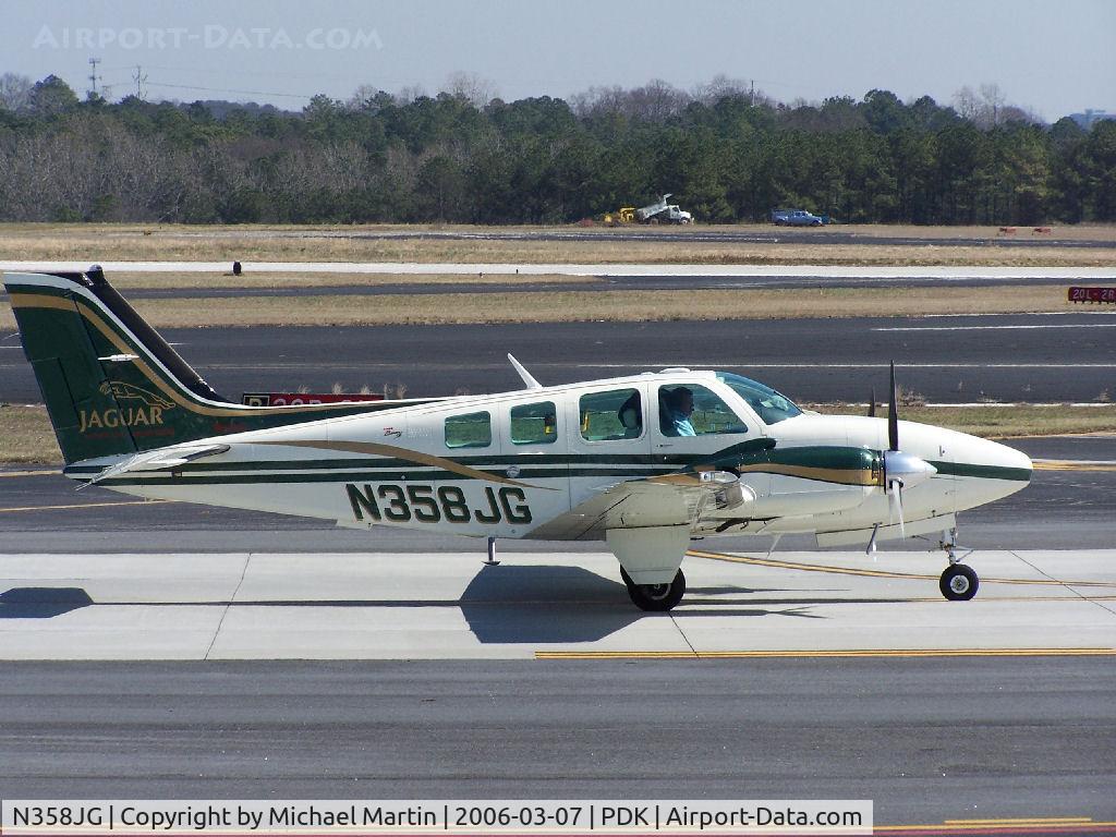 N358JG, 1999 Raytheon Aircraft Company 58 C/N TH-1906, Taxing to 2R - Someone likes Jaguar!