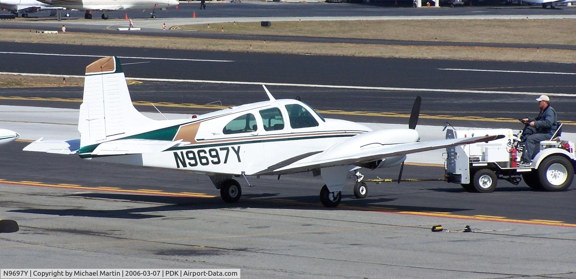 N9697Y, 1963 Beech B95A Travel Air C/N TD-526, Being towed to parking at Epps Air Service