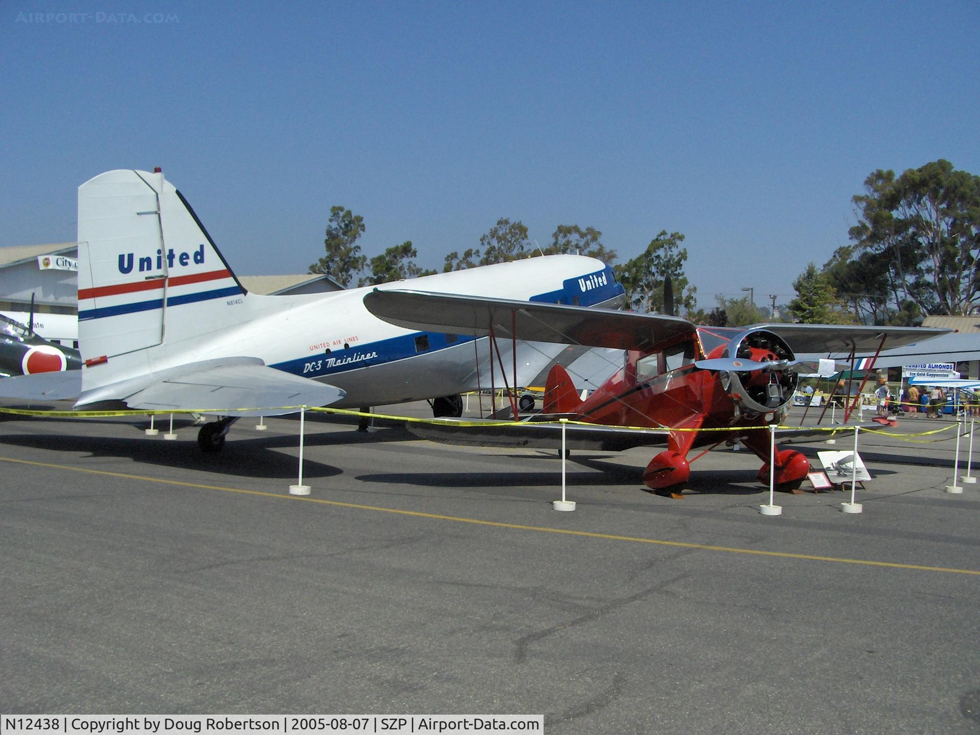N12438, 1932 Waco QDC C/N 3579, 1932 Waco QDC 4 seat cabin biplane, Continental W670 220 Hp, upgrade from original Continental A-70 of 165 Hp, Clay Lacy's Douglas DC-3C N814CL behind