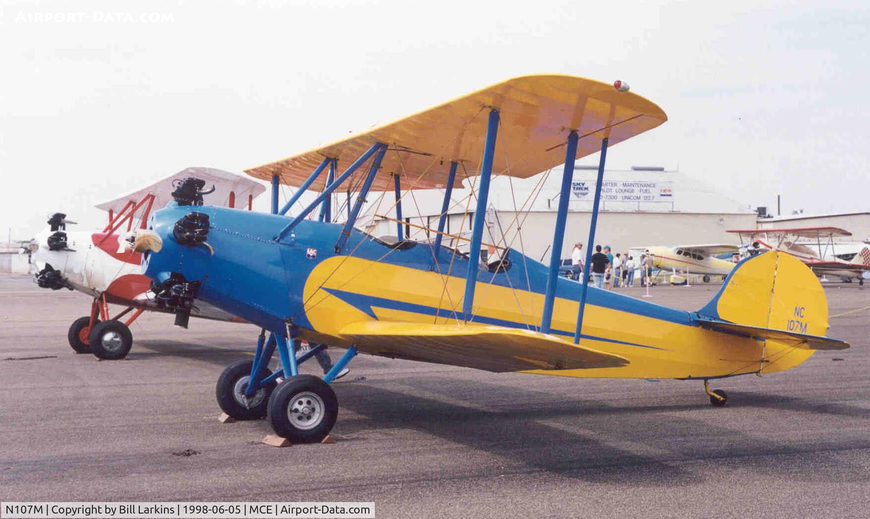 N107M, 1930 Fairchild KR-21 C/N 1011, Next to a Fairchild KR-34