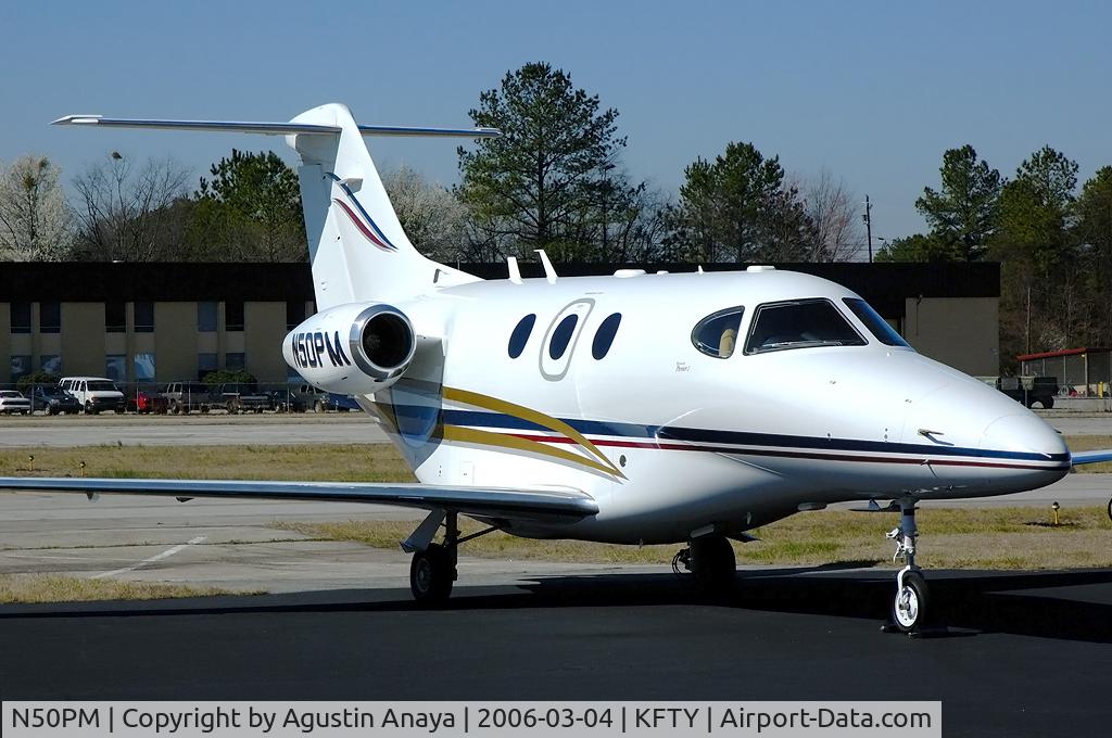 N50PM, 2003 Raytheon Aircraft Company 390 C/N RB-80, On the FBO ramp.