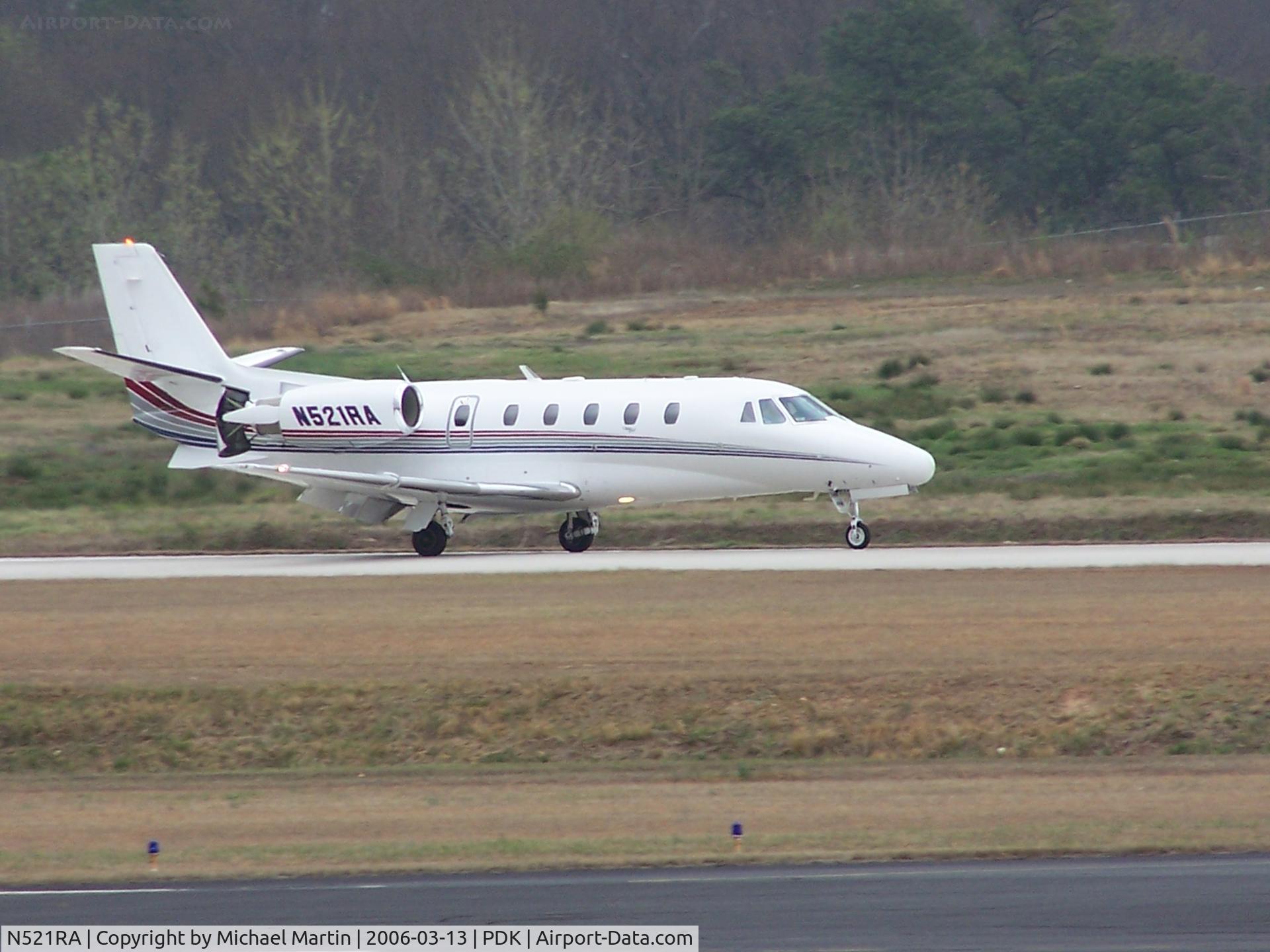 N521RA, 2000 Cessna 560XL C/N 560-5076, Landing PDK on 20L with airbrakes extended