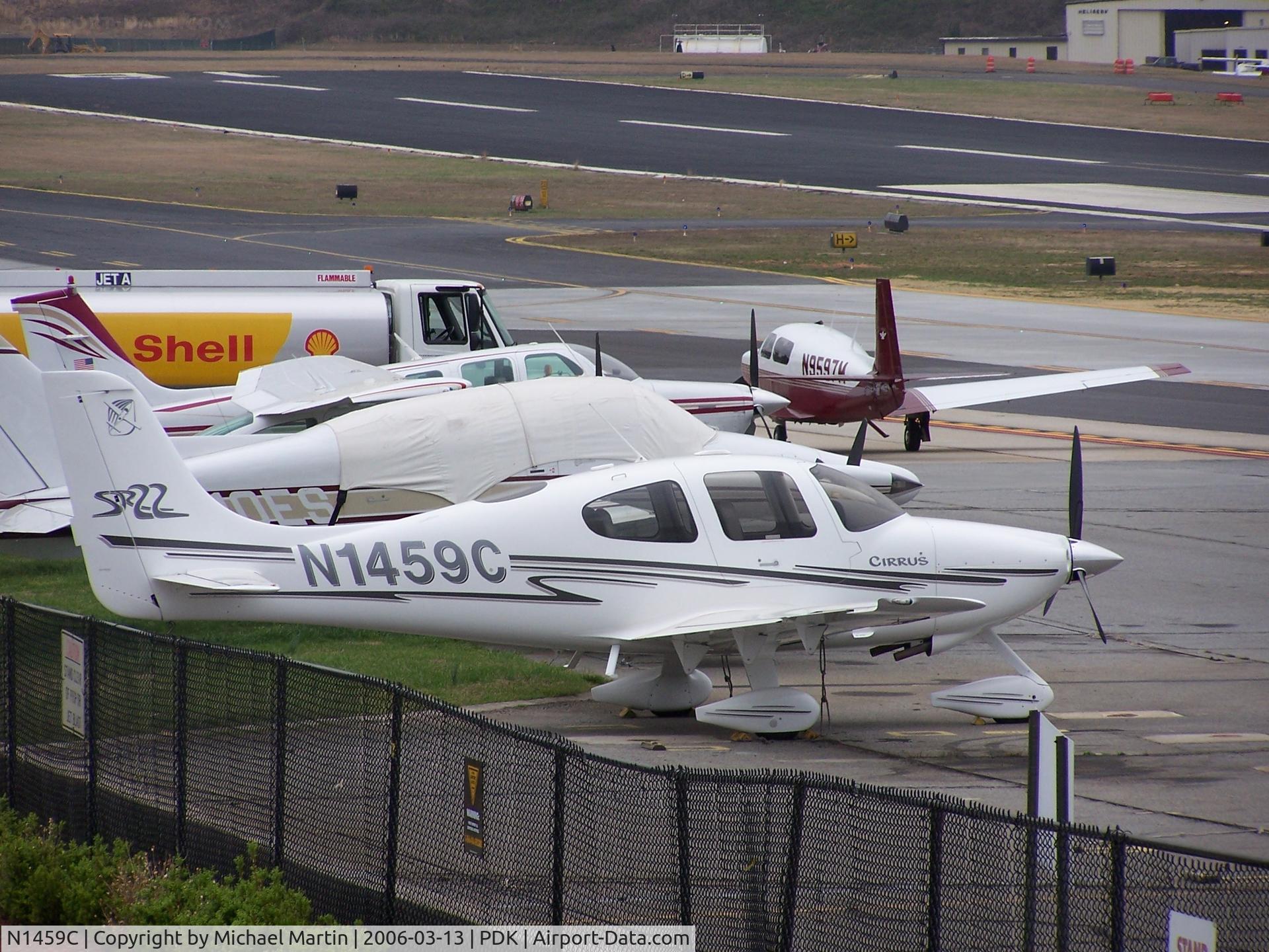 N1459C, 2003 Cirrus SR22 C/N 0548, Tied down @ PDK with vairous AC in background