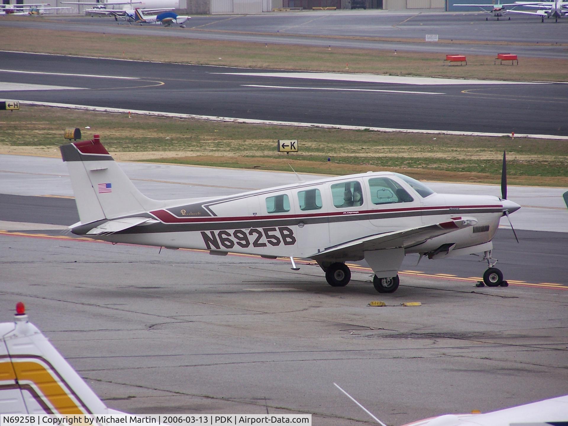 N6925B, 1985 Beech A36 Bonanza 36 C/N E-2258, Tied down @ PDK with vairous AC in background