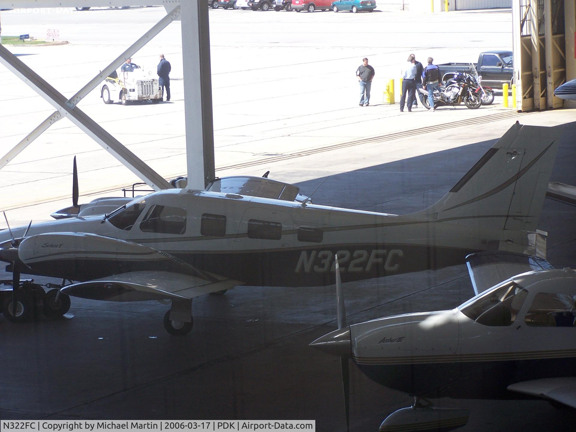 N322FC, 2003 Piper PA-34-200T C/N 34-49275, In Epps Air Service hanger - picture via DIRTY window!