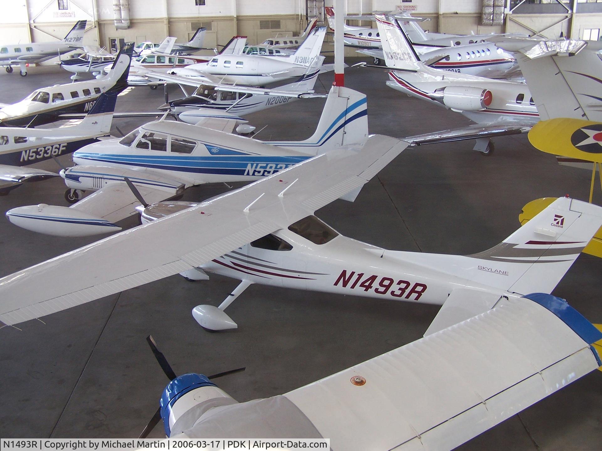 N1493R, 2005 Cessna 182T Skylane C/N 18281694, In Epps Air Service hanger with various other aircraft.