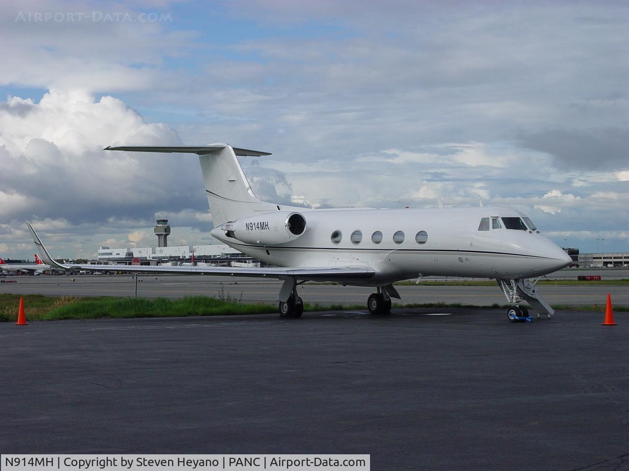 N914MH, 1970 Gulfstream American G-1159 Gulfstream II C/N 091, At home (PANC) with the tower in the background