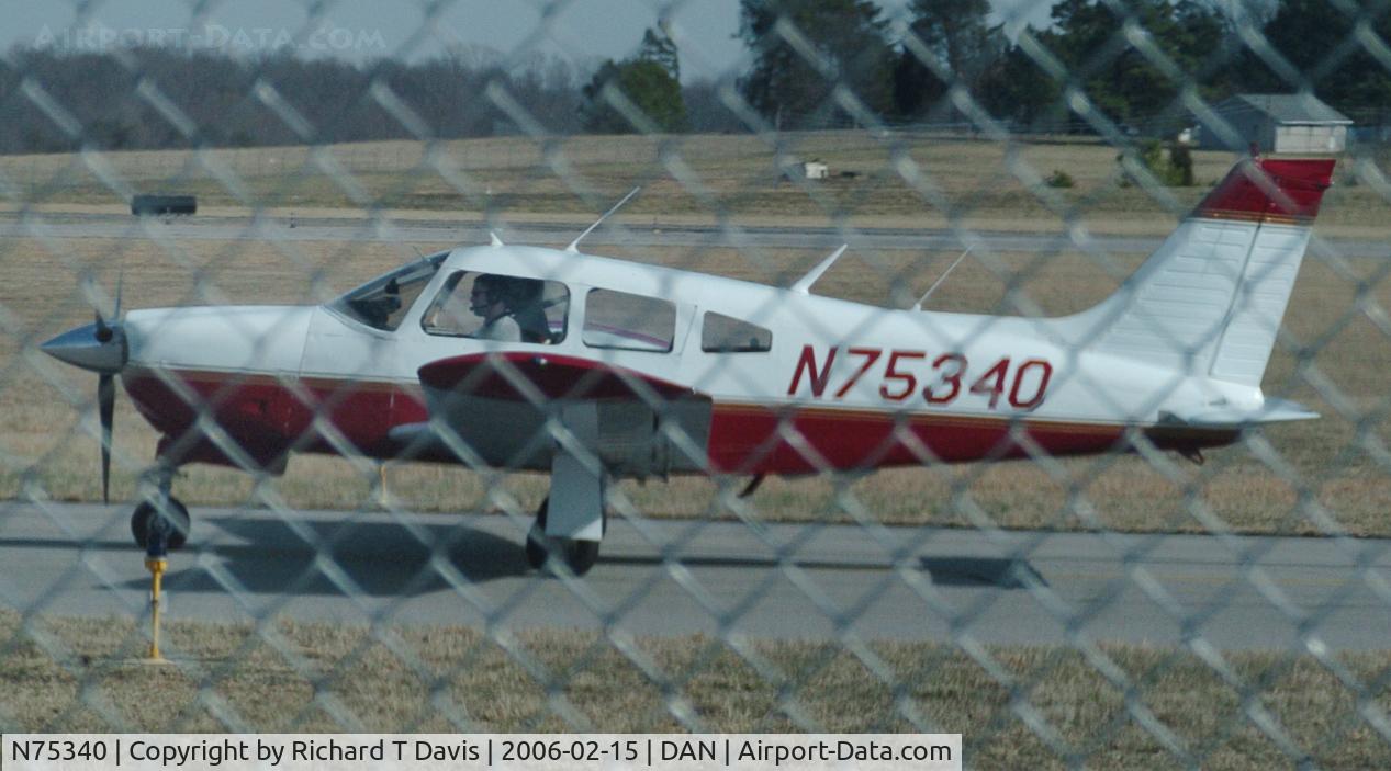N75340, 1976 Piper PA-28R-200 C/N 28R-7635292, Down the Taxiway  shot through the fence as it came in.