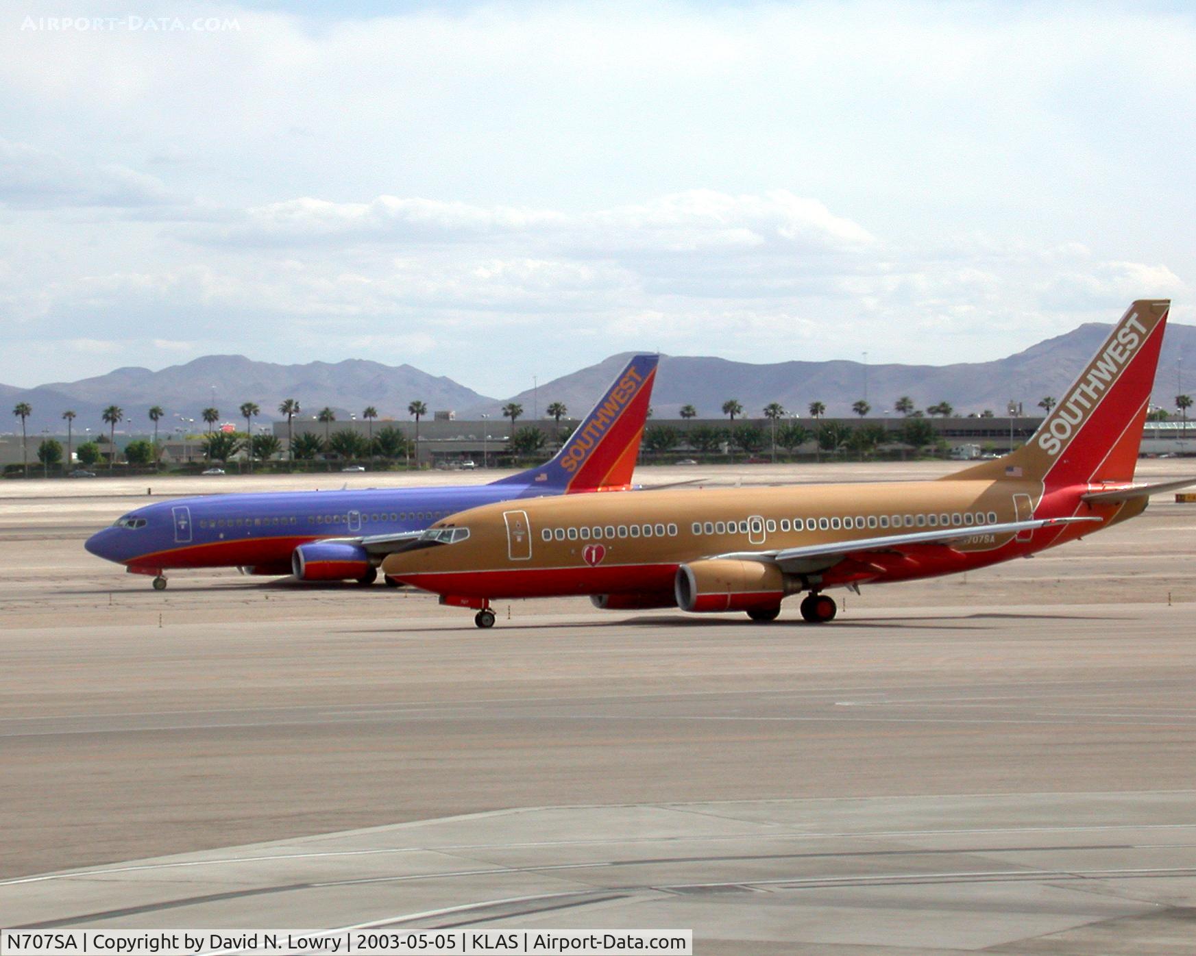 N707SA, 1997 Boeing 737-7H4 C/N 27841, N707SA on th inner while company passes on the outer.