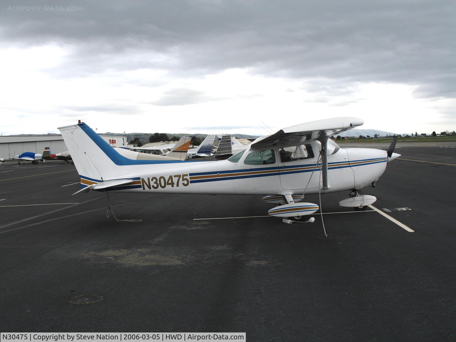 N30475, 1973 Cessna 172M C/N 17262791, 2002 Cessna 172M at stormy Hayward Air Terminal, CA