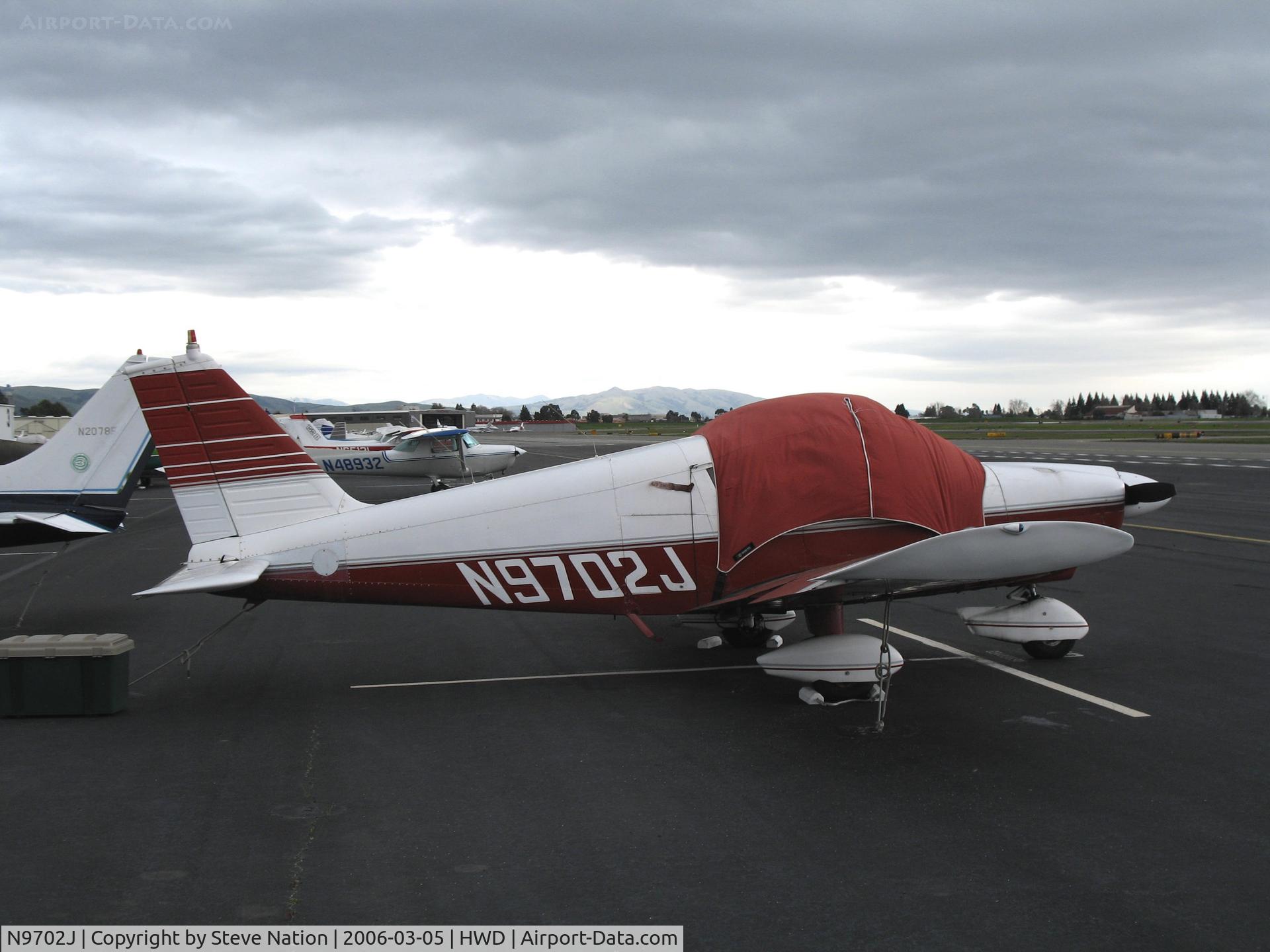 N9702J, 1967 Piper PA-28-180 C/N 28-3892, Piper PA-28-180 at stormy Hayward Air Terminal, CA
