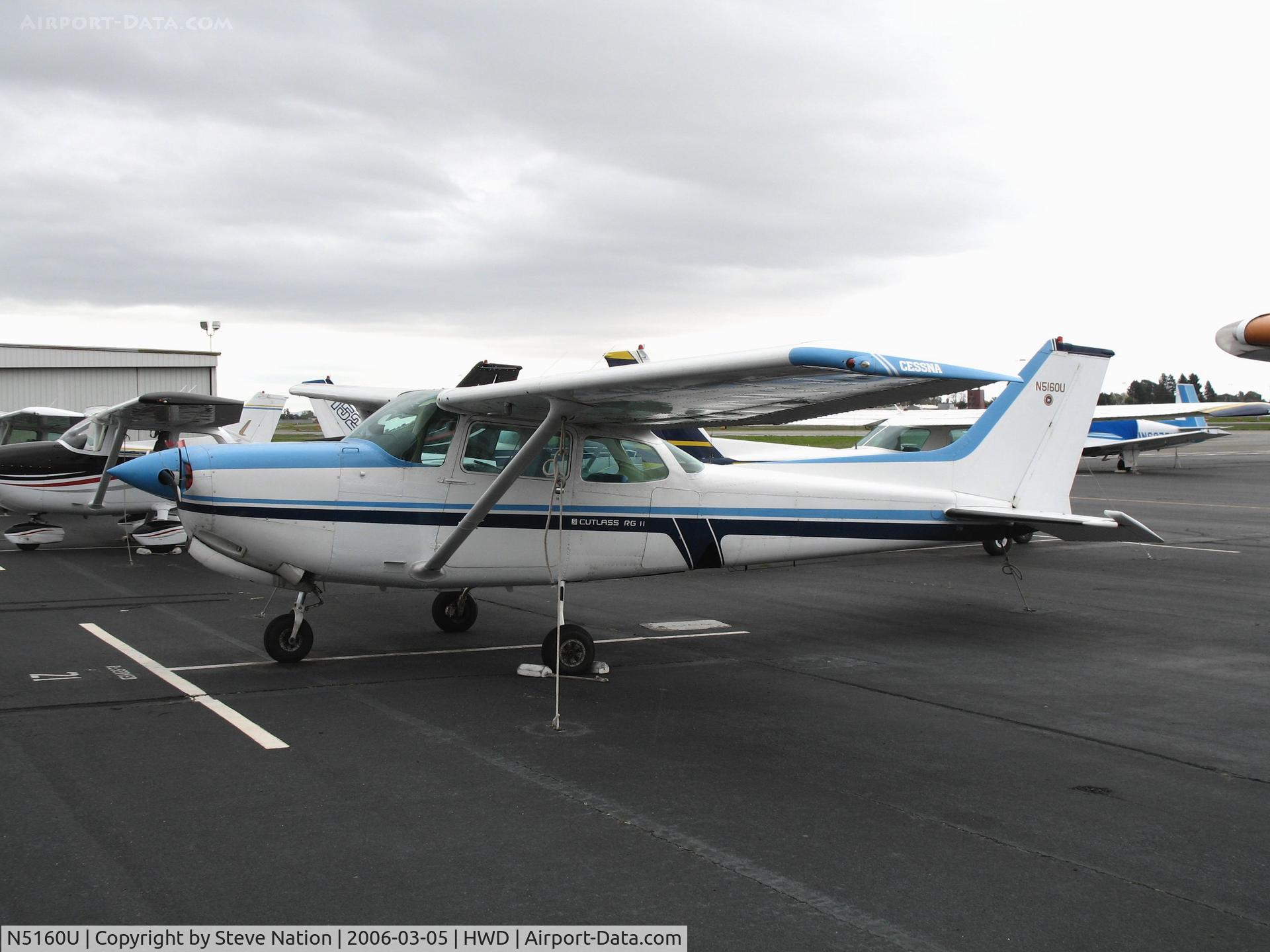 N5160U, 1980 Cessna 172RG Cutlass RG C/N 172RG0266, 1980 Cessna 172RG with Top Gun logo at stormy Hayward Air Terminal, CA