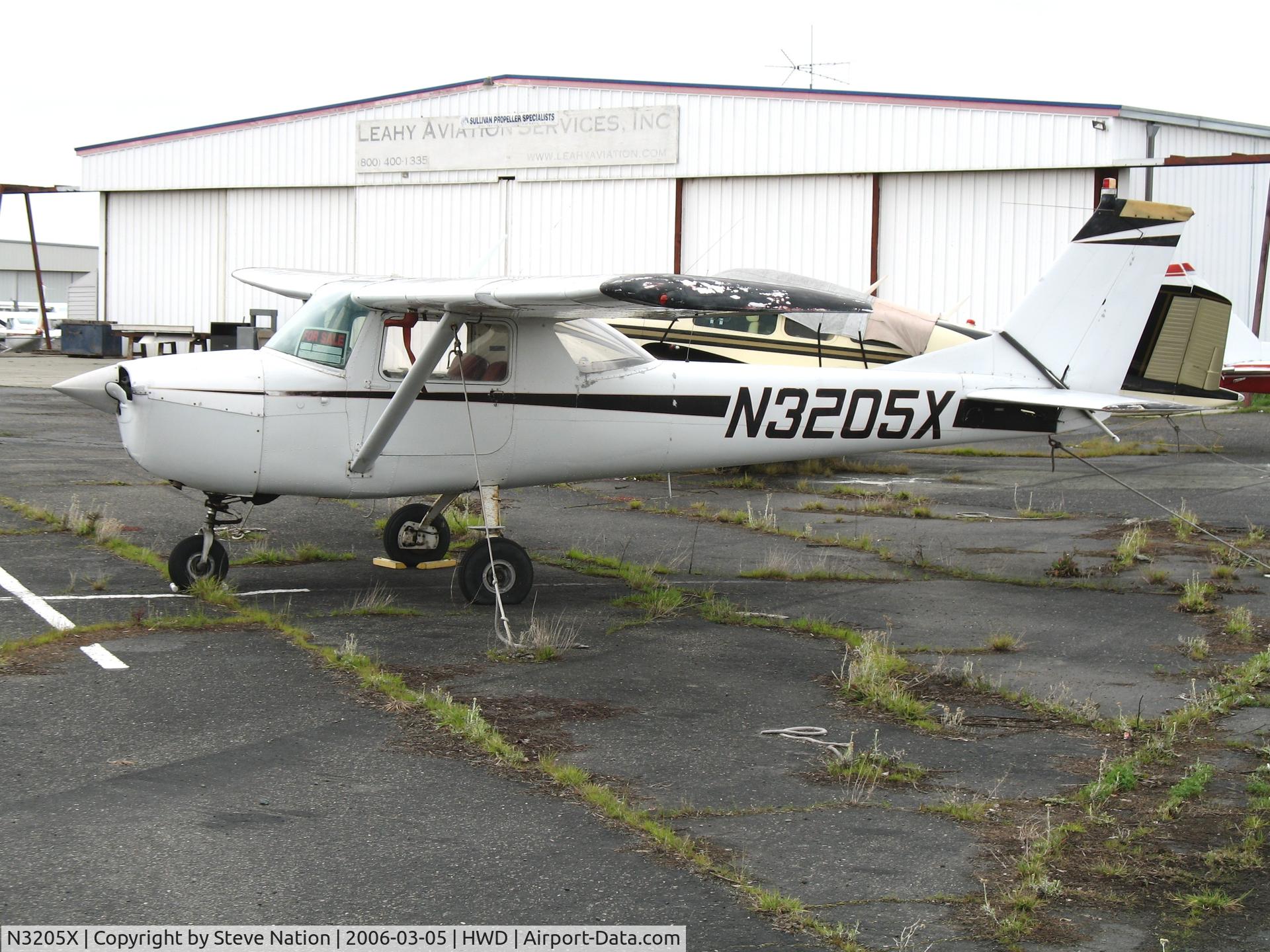 N3205X, 1966 Cessna 150G C/N 15064605, 1960 Cessna 150G at stormy Hayward Air Terminal, CA