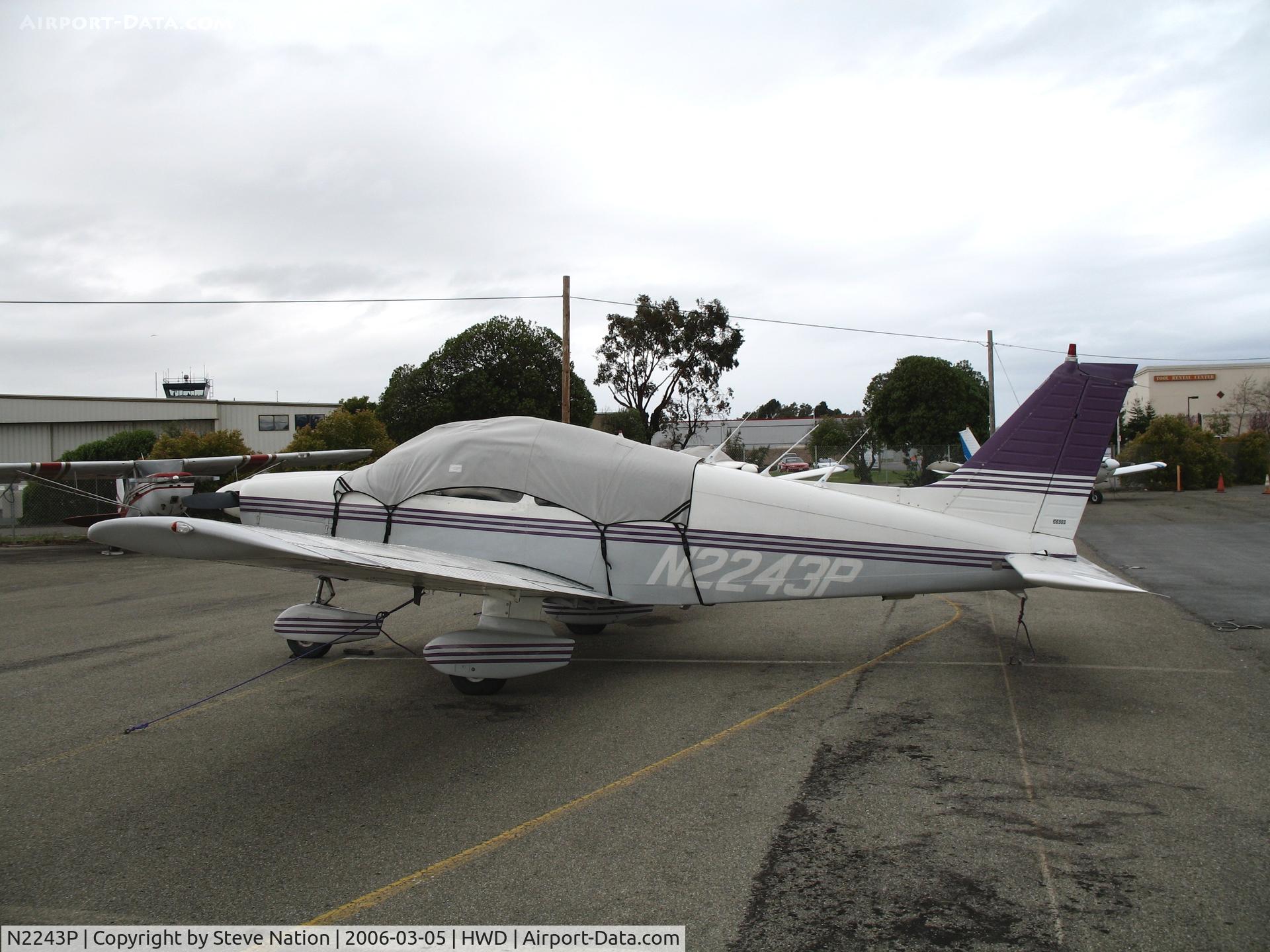 N2243P, 1979 Piper PA-28-181 C/N 28-7990295, 1979 Piper PA-28-181 under tarp at stormy Hayward Air Terminal, CA
