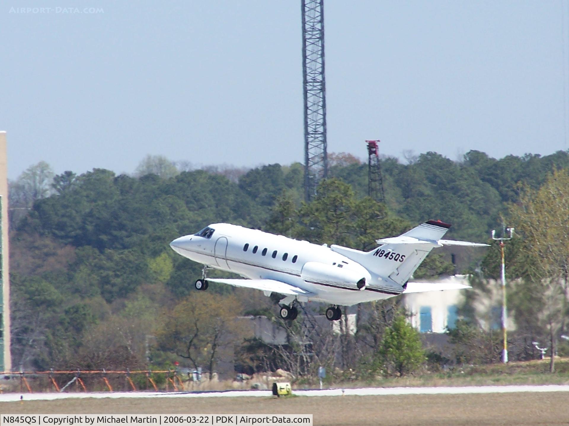 N845QS, 2001 Raytheon Hawker 800XP C/N 258545, Departing PDK - Starting to rotate gear.