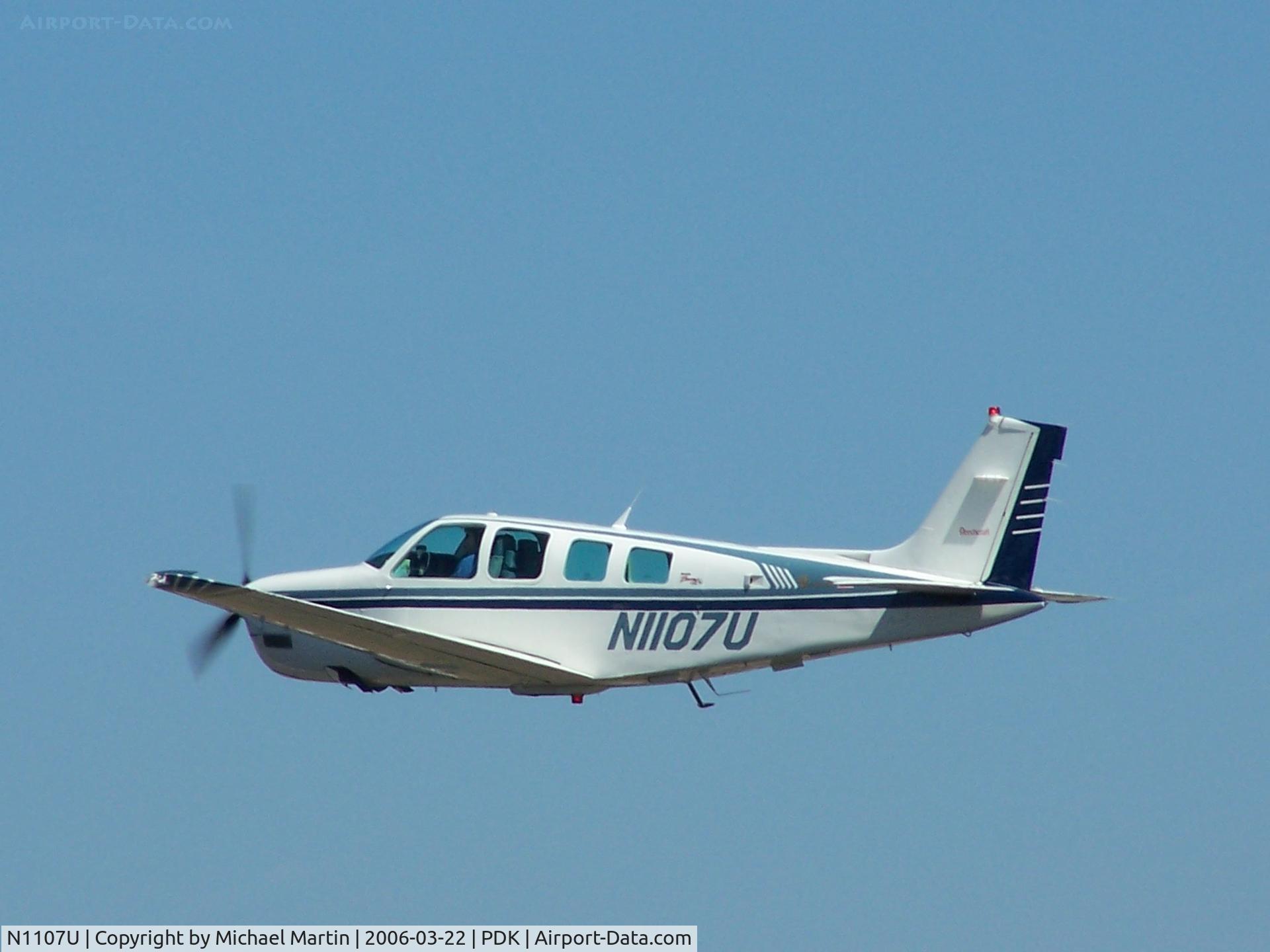 N1107U, 1997 Raytheon Aircraft Company A36 Bonanza C/N E-3077, In flight after leaving PDK