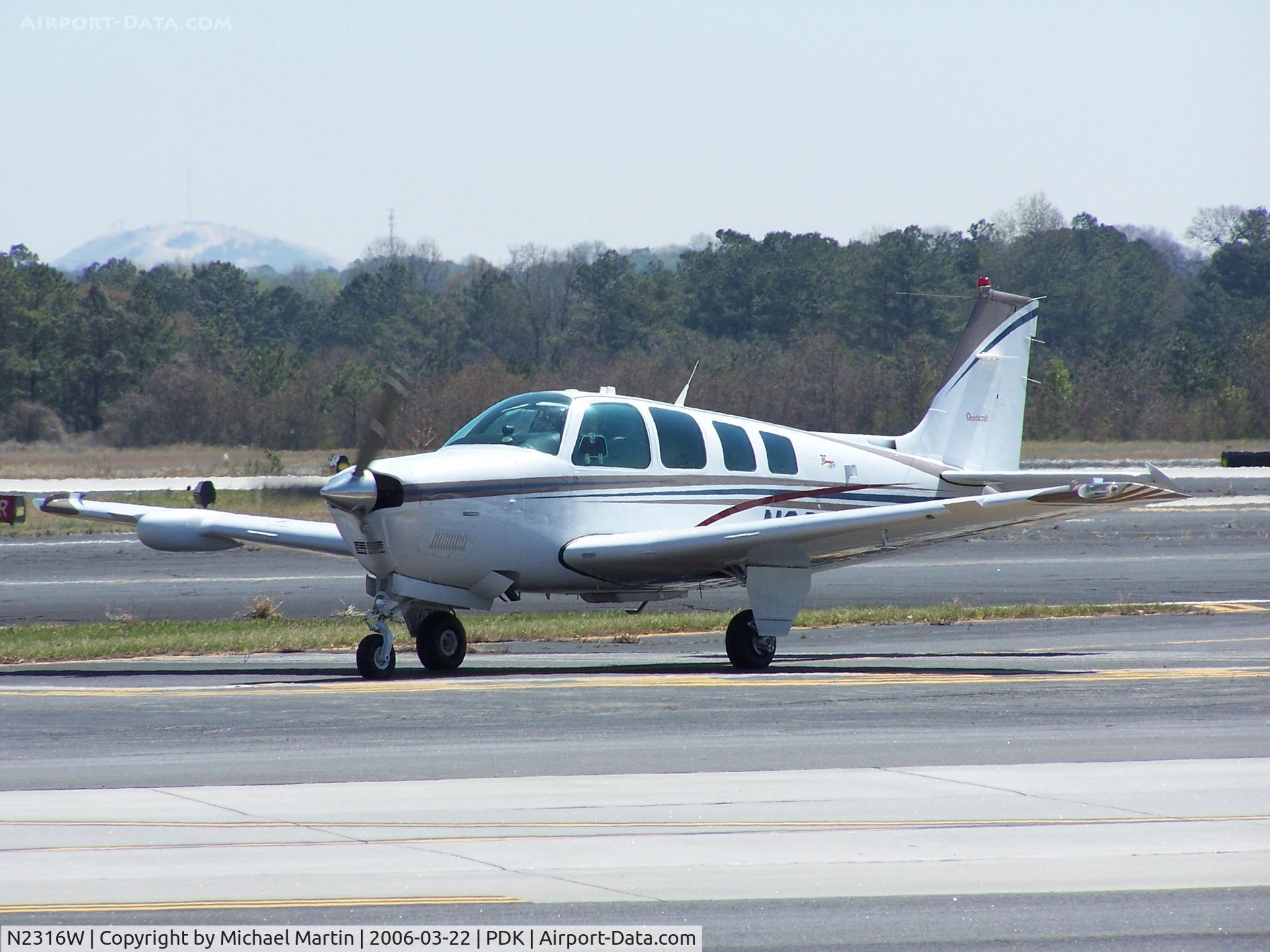 N2316W, 1998 Raytheon Aircraft Company A36 Bonanza C/N E-3160, Taxing to Epps Air Service