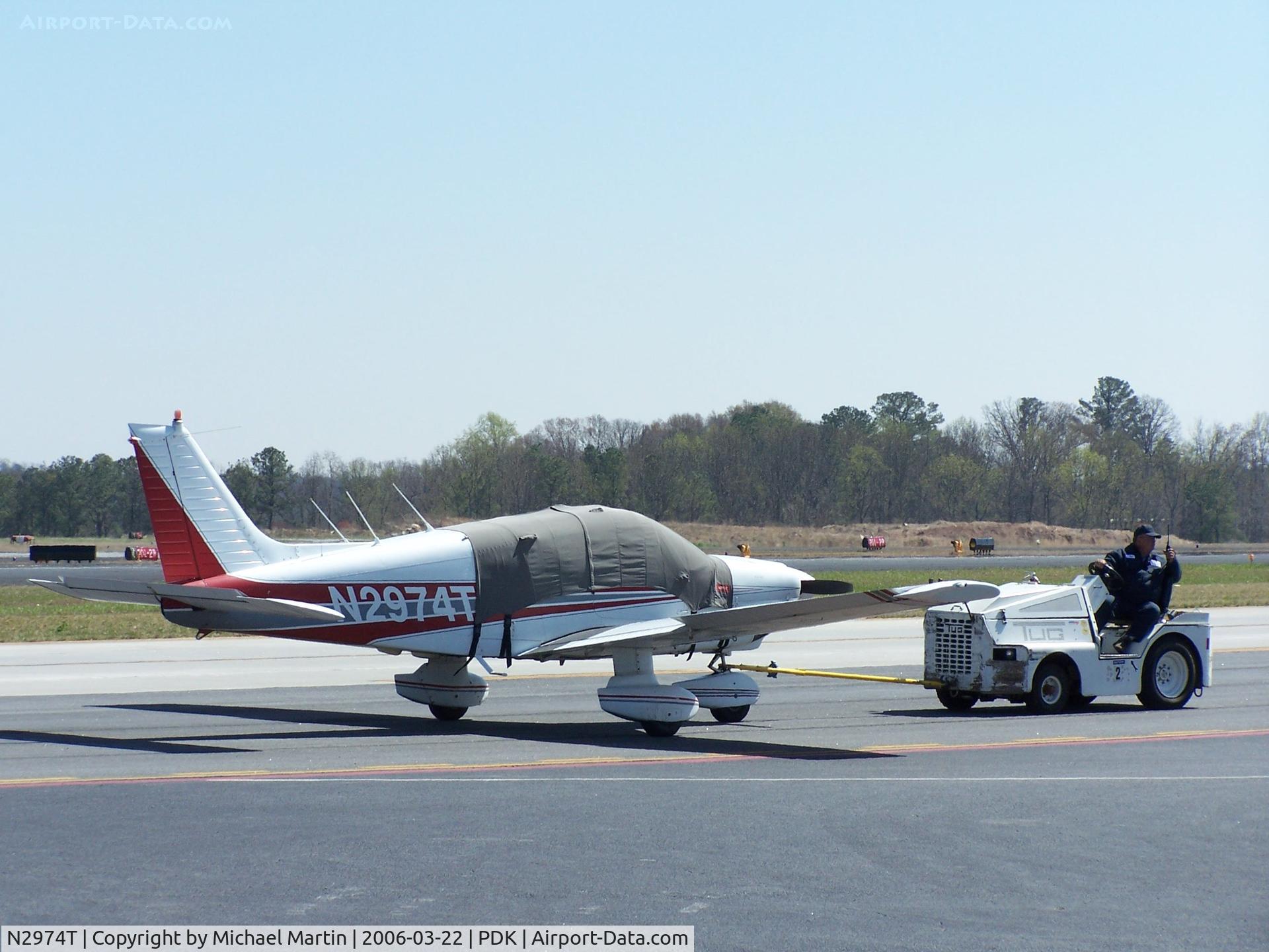N2974T, 1979 Piper PA-28-181 C/N 28-8090024, Being towed to parking at Mercury Air Center