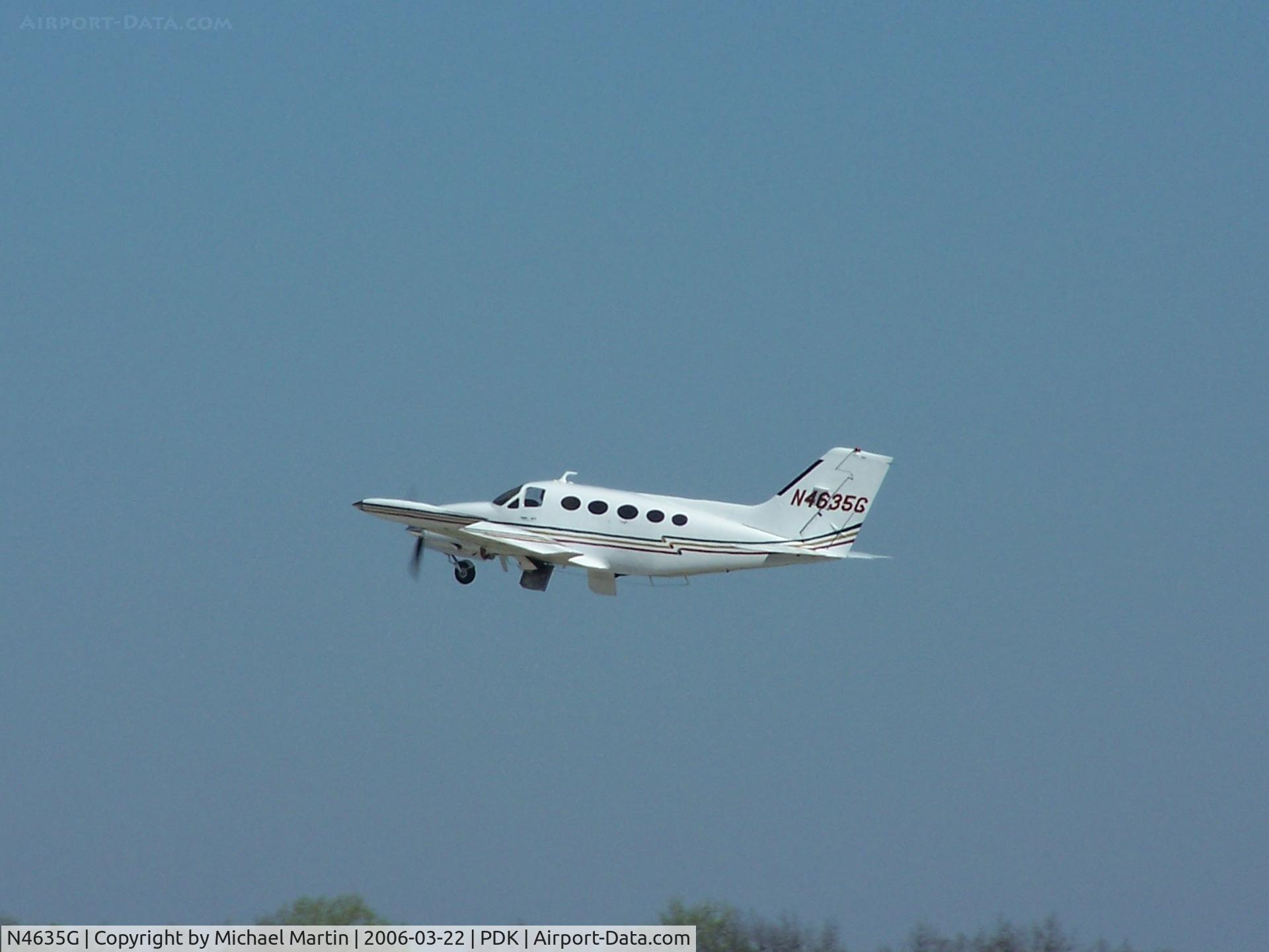 N4635G, 1977 Cessna 414 Chancellor C/N 414-0906, Departing PDK - Starting to rotate gear.