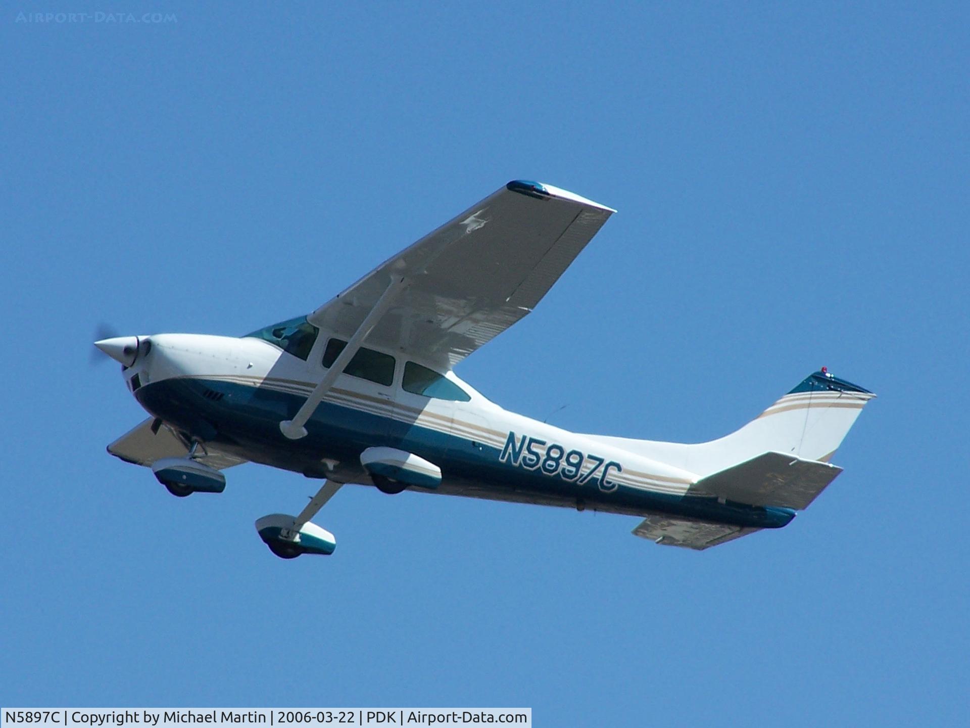 N5897C, 1973 Cessna 182P Skylane C/N 18262437, In flight after leaving PDK