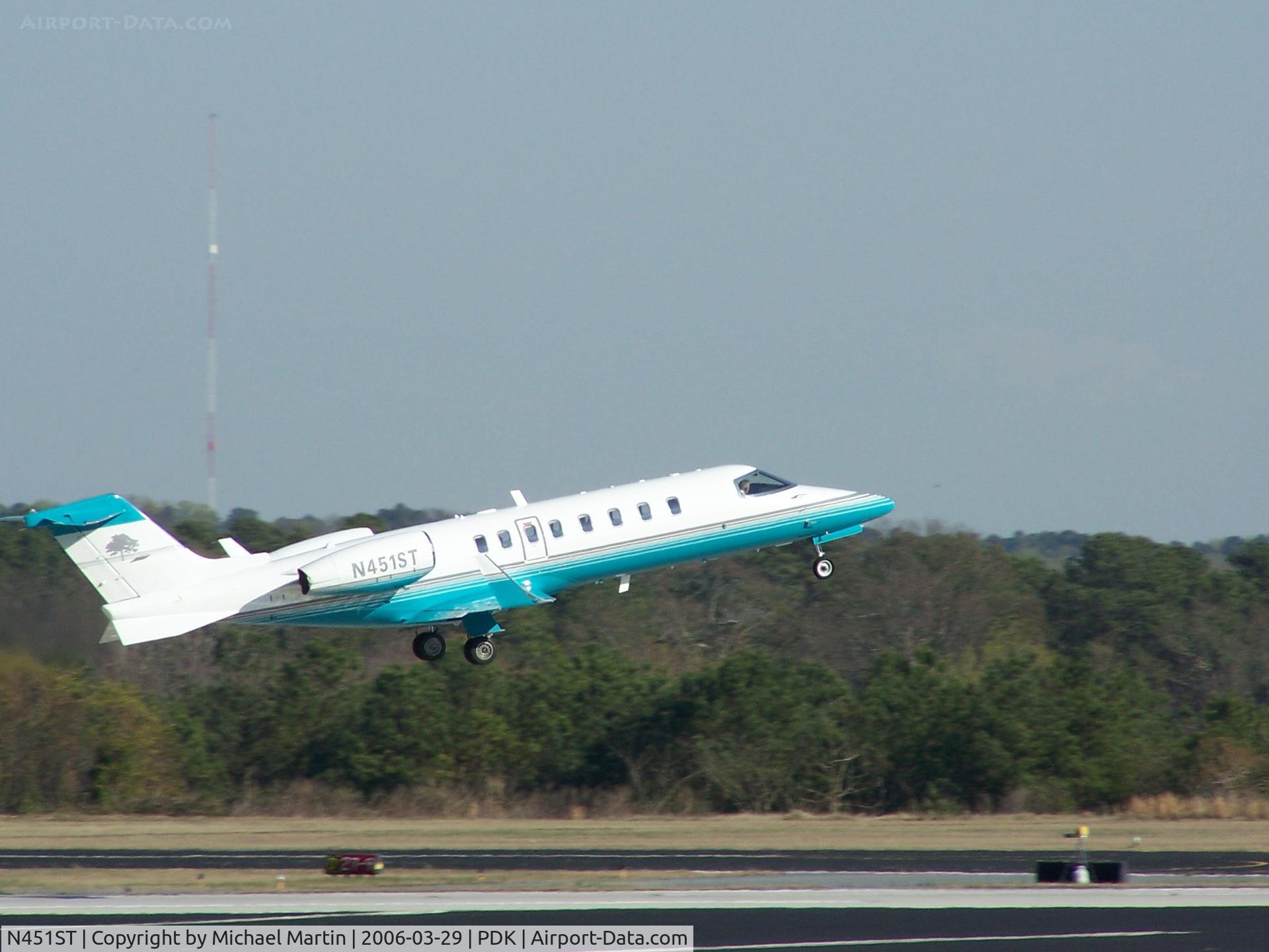 N451ST, 2002 Learjet 45 C/N 200, Departing PDK - Starting to rotate gear.