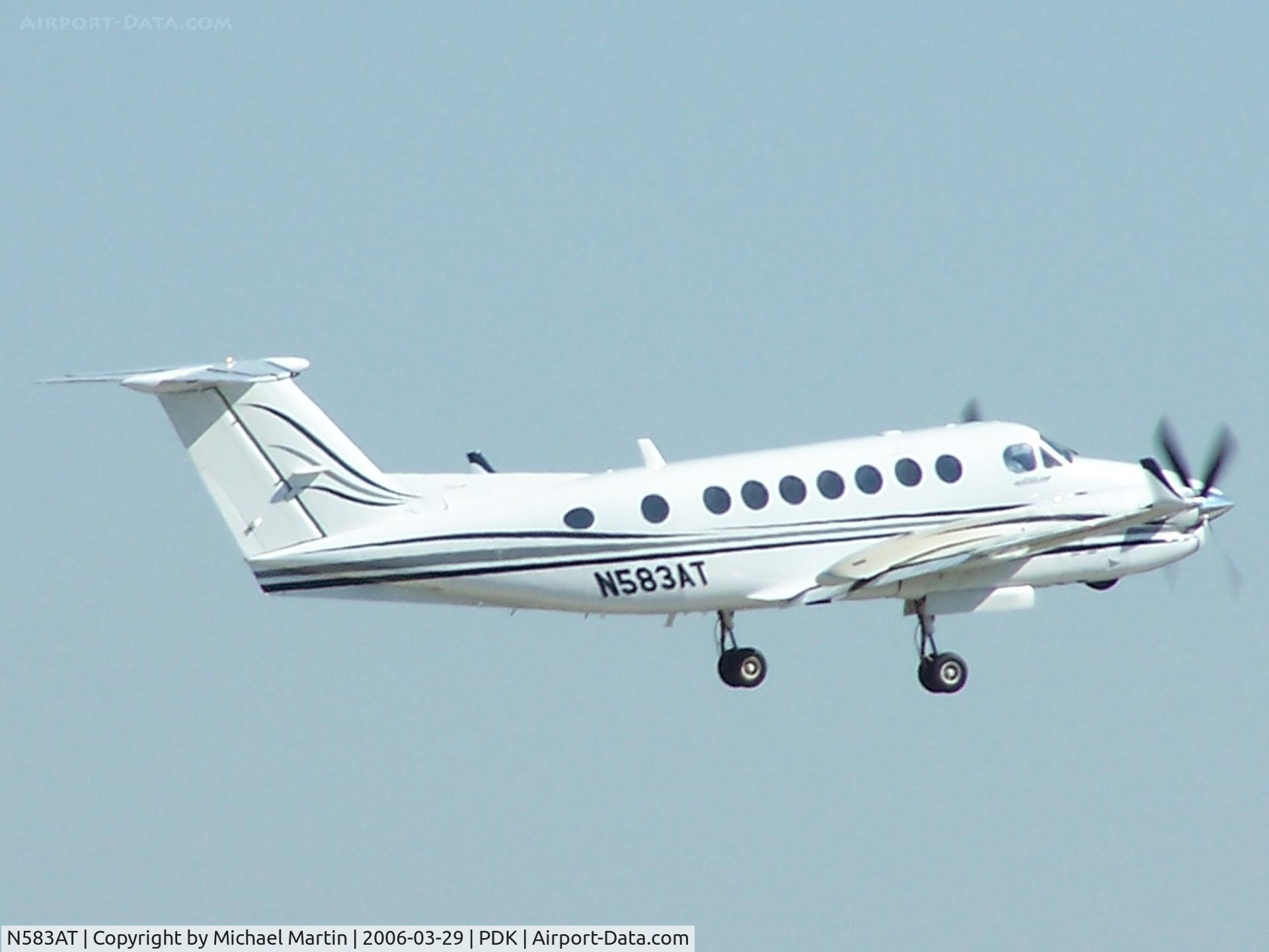 N583AT, Raytheon Aircraft Company B300 C/N FL-258, Departing PDK - Starting to rotate gear.