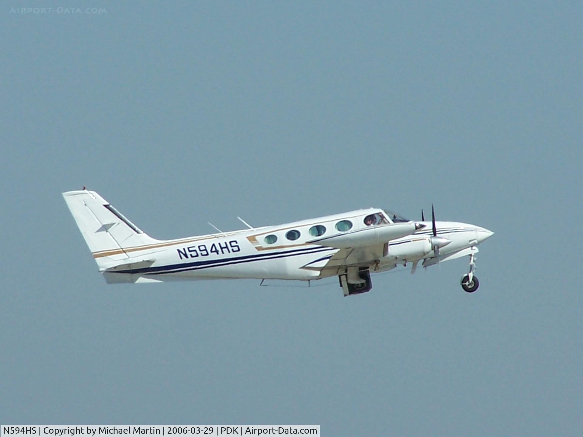 N594HS, 1978 Cessna 340A C/N 340A0440, Departing PDK - Starting to rotate gear.