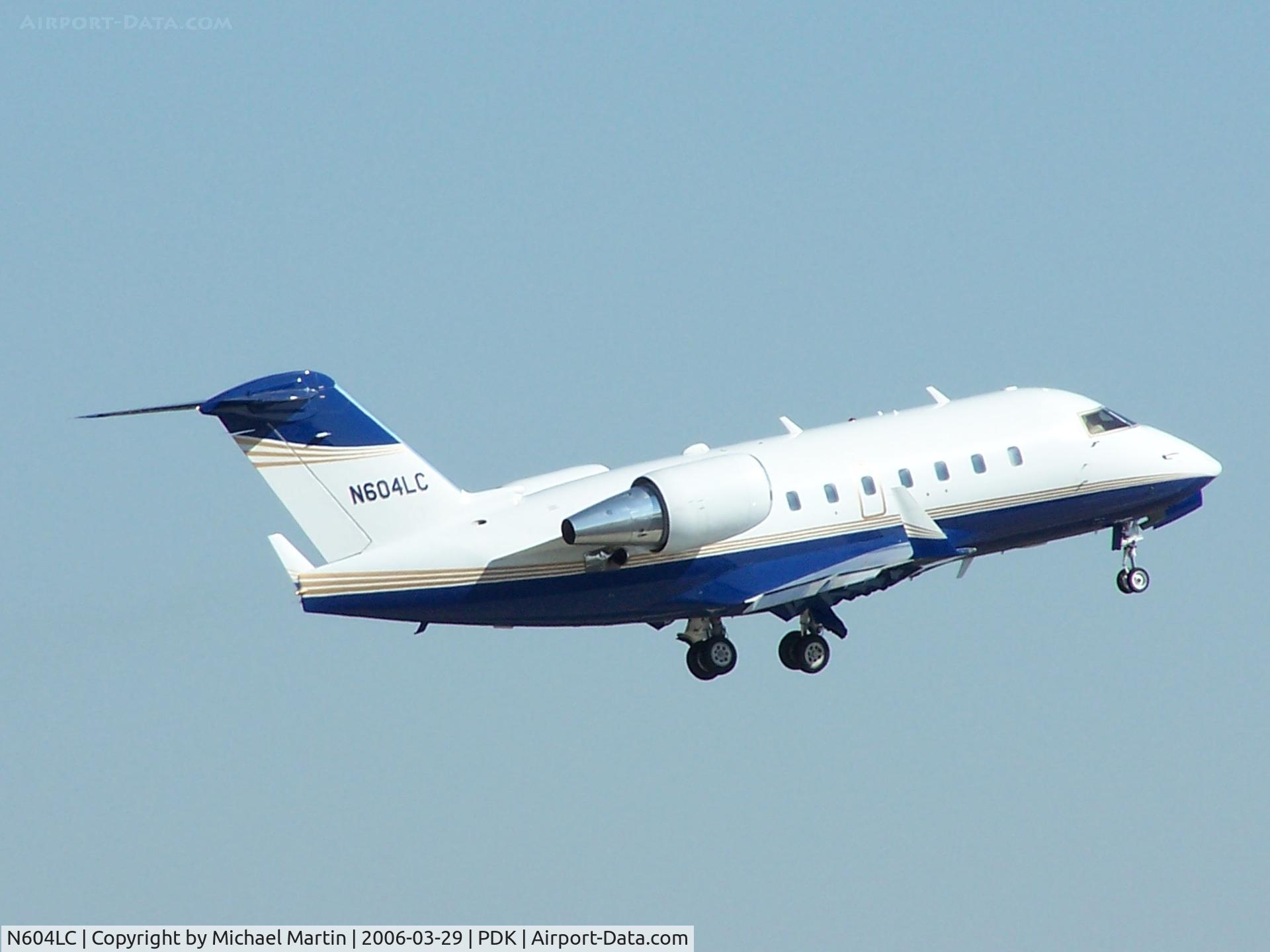 N604LC, 1998 Bombardier Challenger 604 (CL-600-2B16) C/N 5373, Departing PDK - Gear Up!