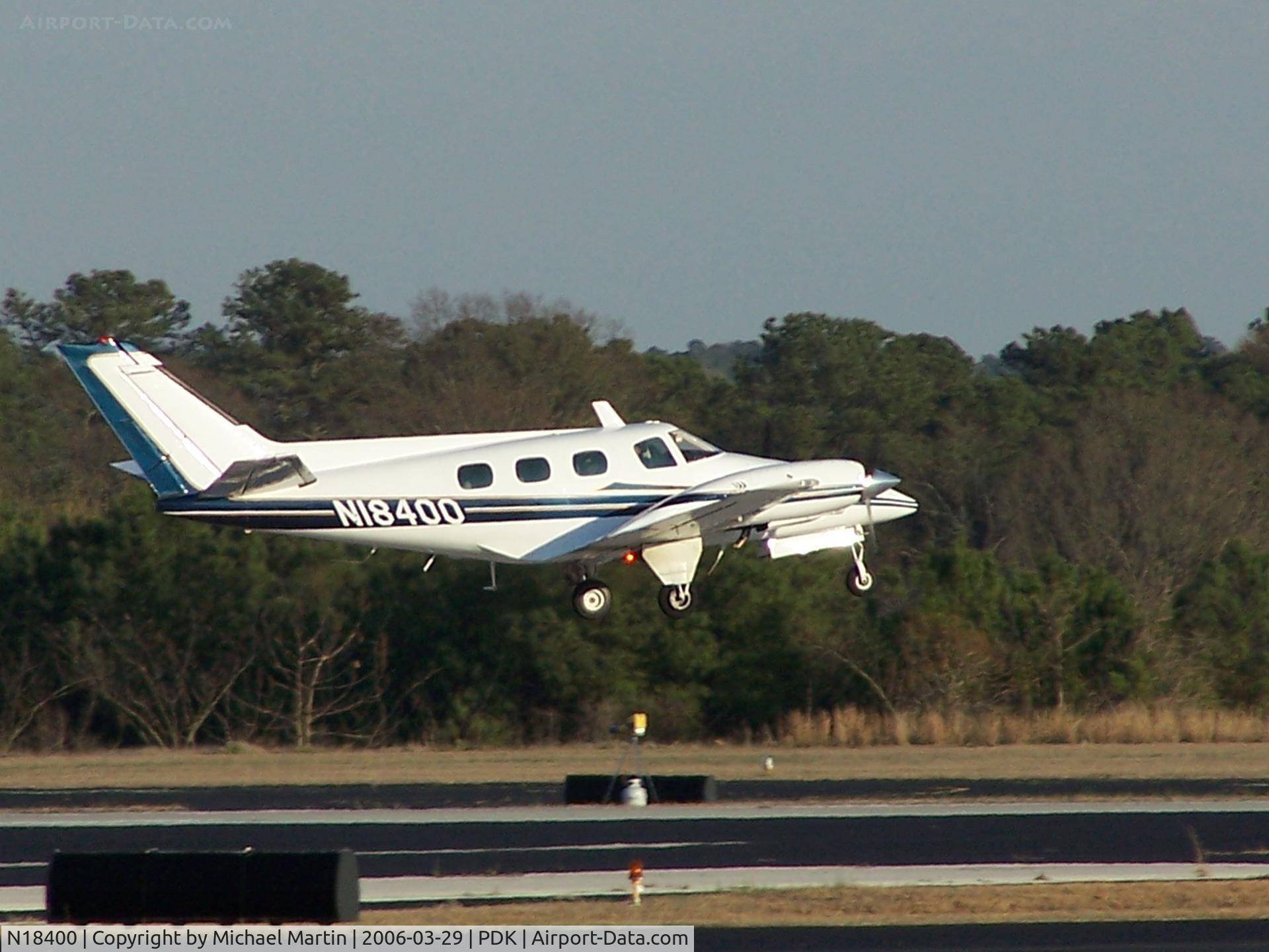 N18400, 1977 Beech B-60 Duke C/N P-412, Departing PDK - Starting to rotate gear.