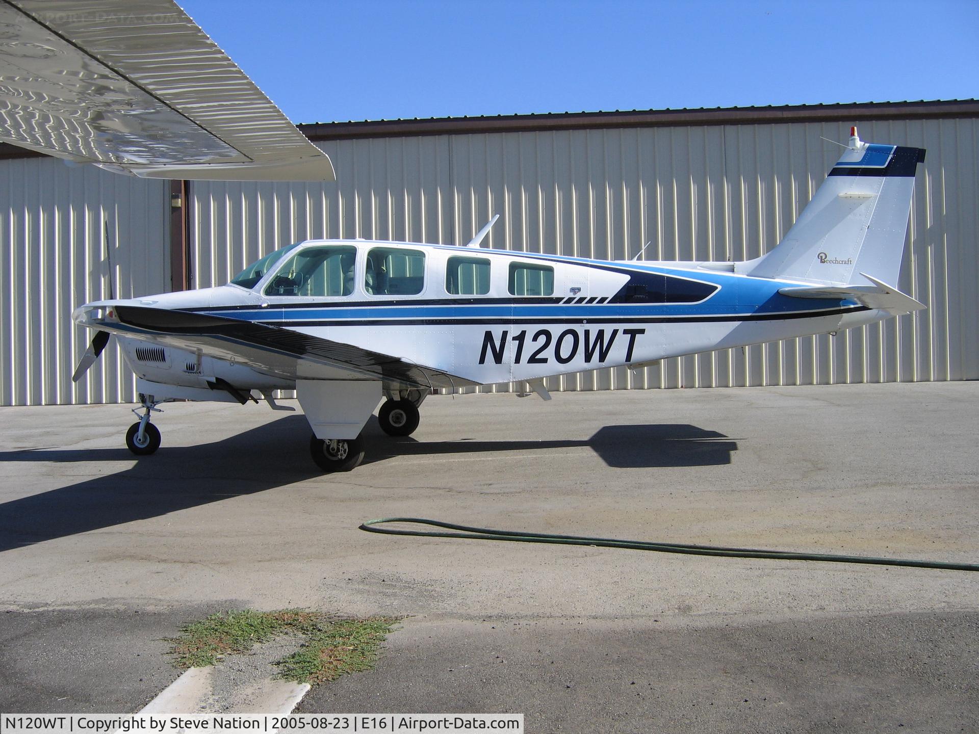 N120WT, 1980 Beech A36TC Bonanza 36 C/N EA-99, in the summer sun at South County Airport, San Martin, CA