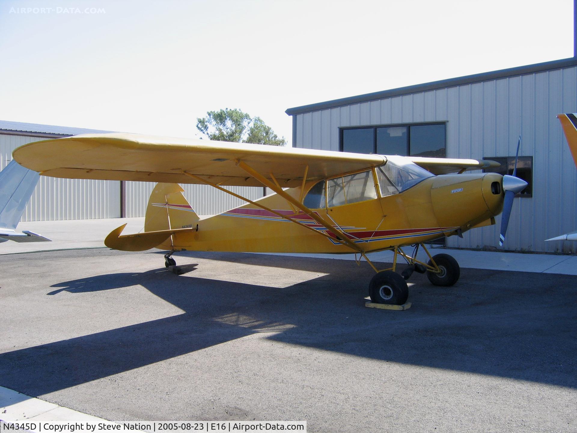 N4345D, Piper PA-12 Super Cruiser C/N 12-3300, Piper PA-12 seeking shade in the summer sun at South County Airport, San Martin, CA