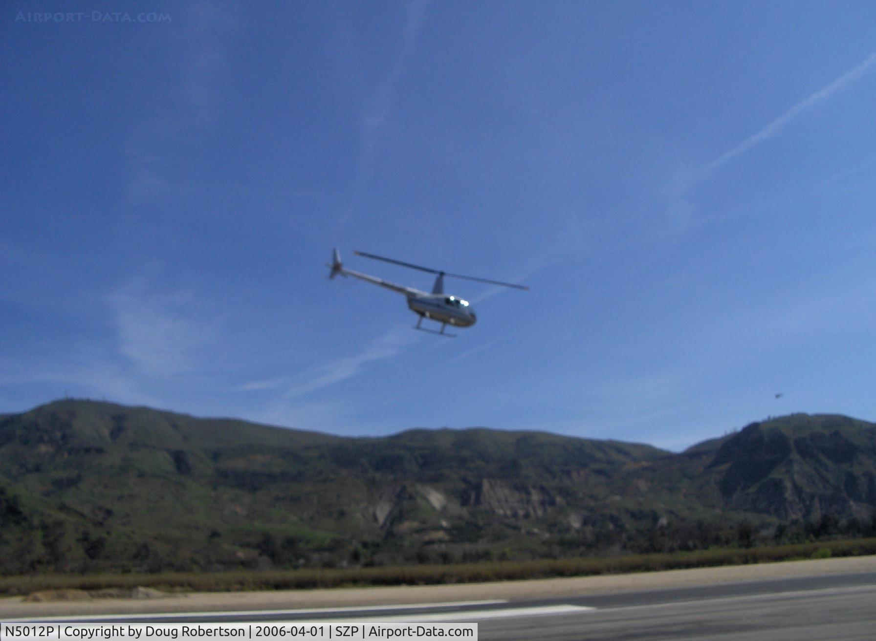 N5012P, 2005 Robinson R44 II C/N 10740, 2005 Robinson R44 RAVEN II, Lycoming IO-540 derated to 245 Hp for 5 min., 205 Hp cont., takeoff from SZP Helipad and climbout Runway 22