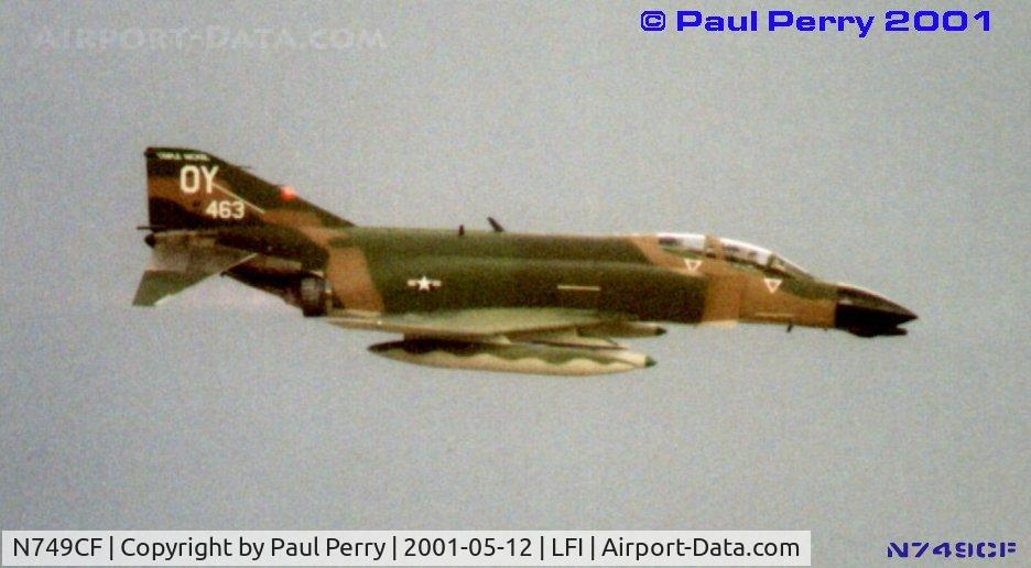 N749CF, 1965 McDonnell F-4D Phantom II C/N 1813 (65-0749), The sky darkens with thunderclouds, and forces Steve Ritchie to cut his demo short
