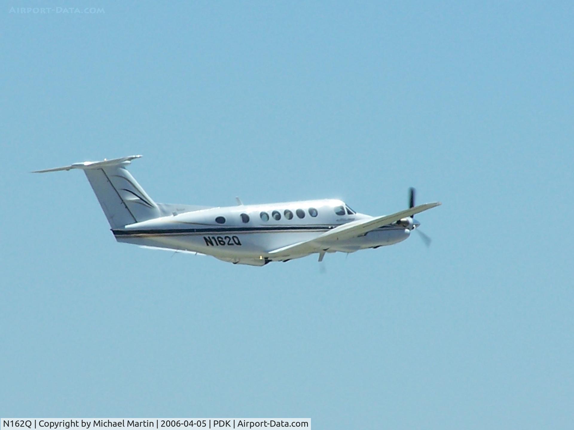 N162Q, 1982 Beech B200 King Air C/N BB-1104, Departing PDK - Gear Up!
