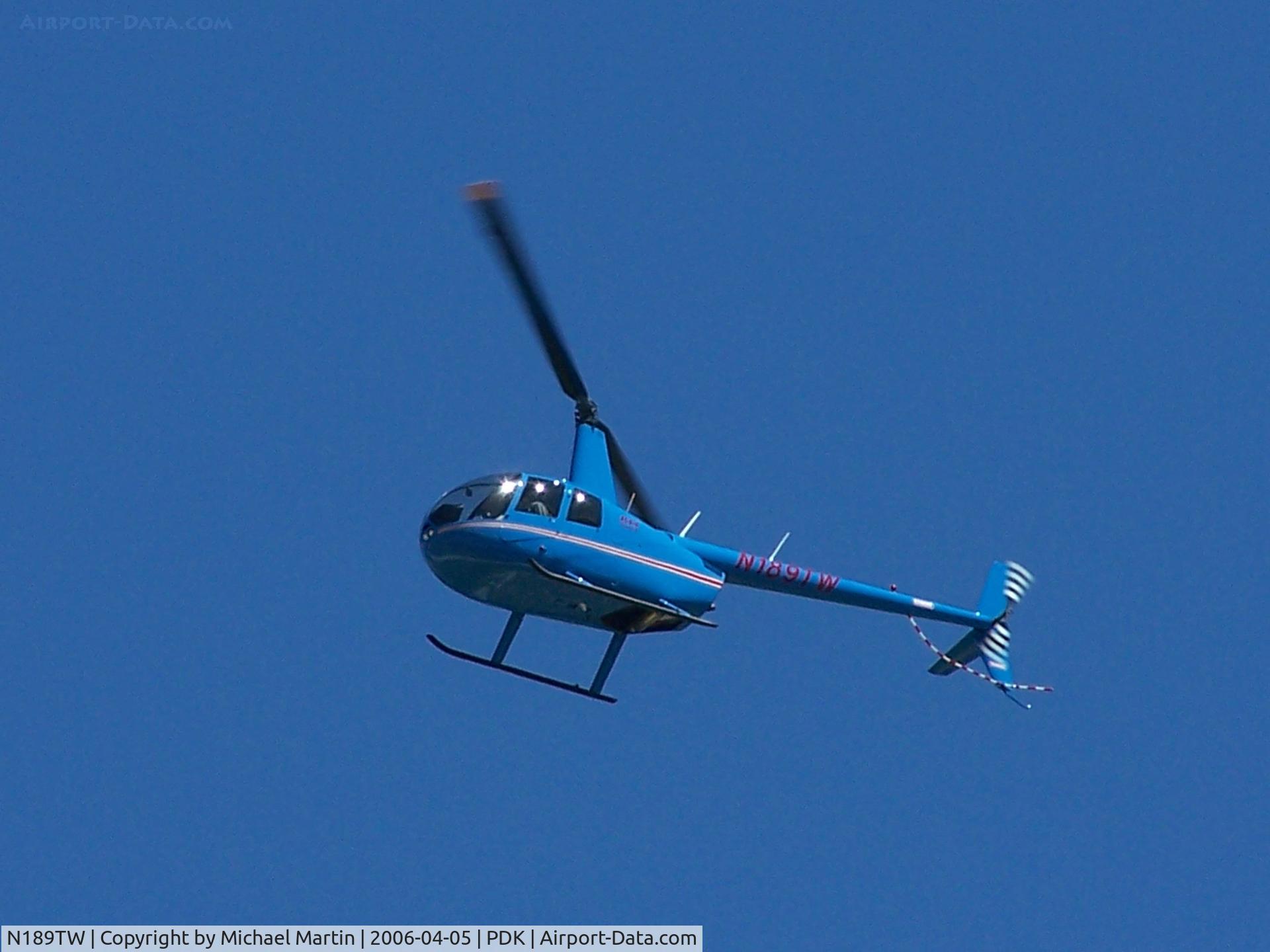 N189TW, 2005 Robinson R44 II C/N 11025, Helo overhead airport.
