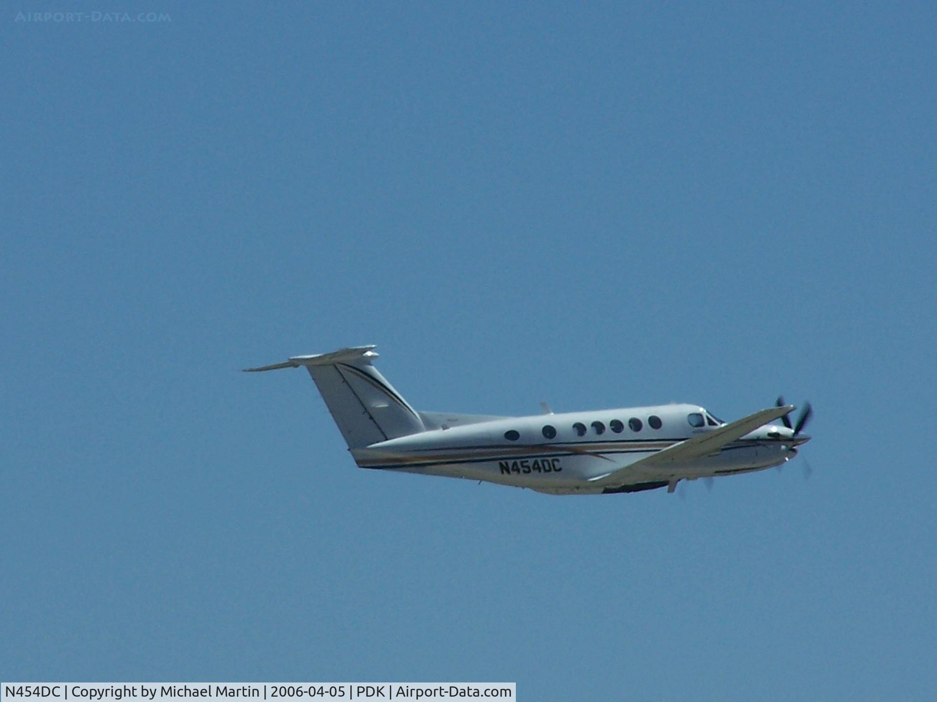 N454DC, 1981 Beech B200 King Air C/N BB-995, Departing PDK - Gear Up!