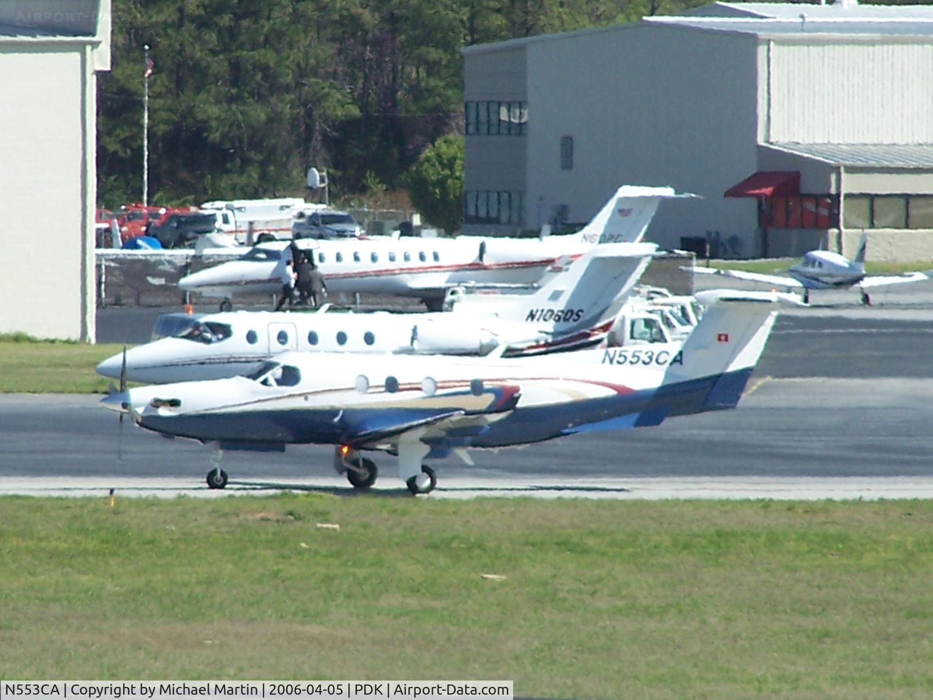 N553CA, 2004 Pilatus PC-12/45 C/N 553, Long range photo - pardon the quality - taxing to Epps