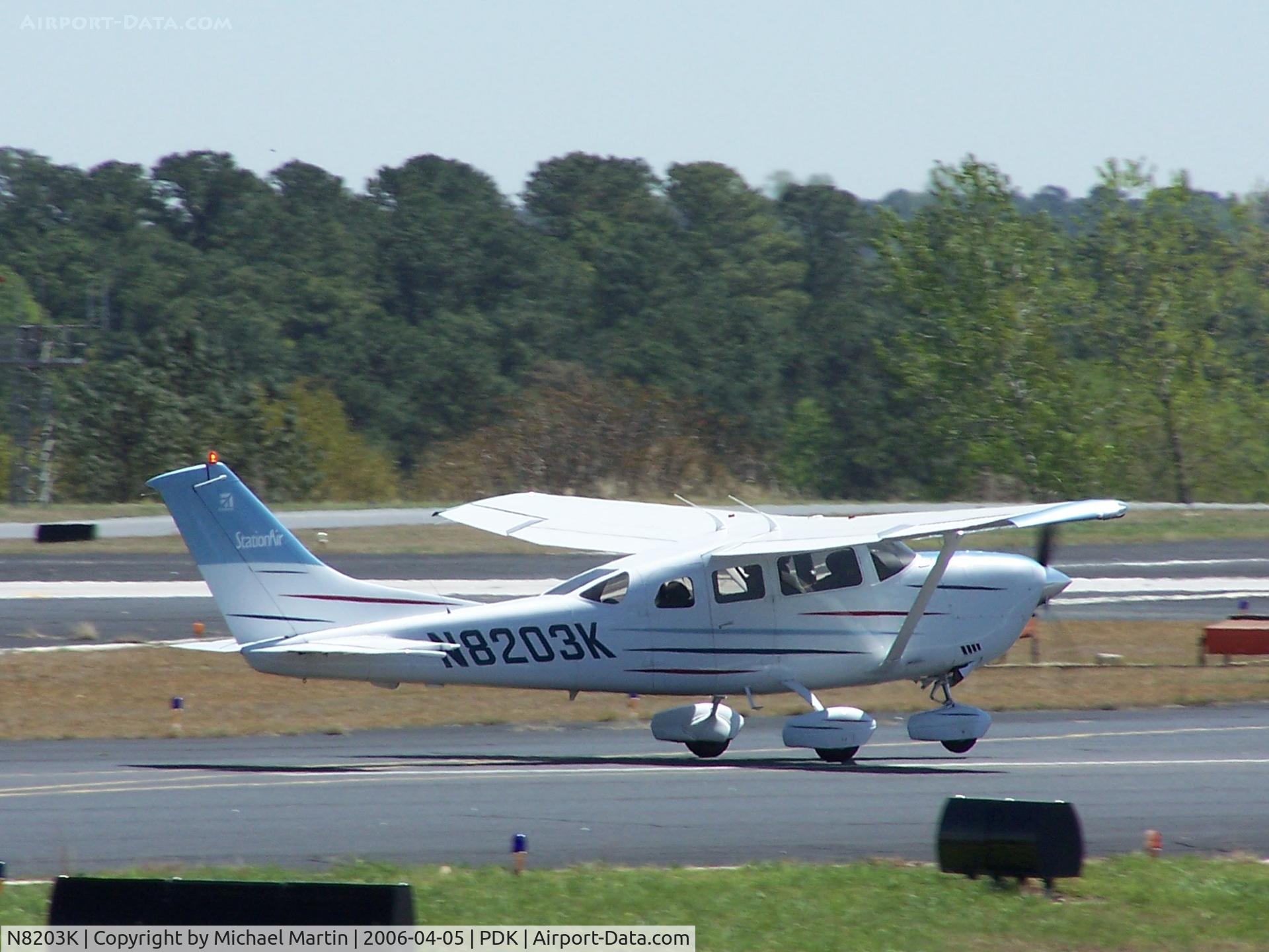 N8203K, 2004 Cessna 206H Stationair C/N 20608203, Landing on 20R