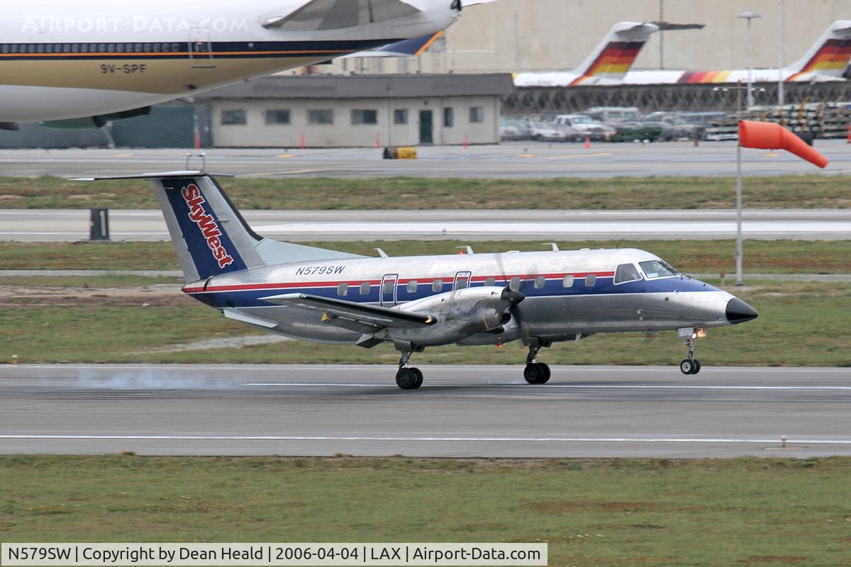 N579SW, 1998 Embraer EMB-120ER Brasilia C/N 120347, Skywest (FLT 6128) Embraer EMB-120 Brasilia touching down on RWY 7R arriving from Ontario Int'l (KONT), California.