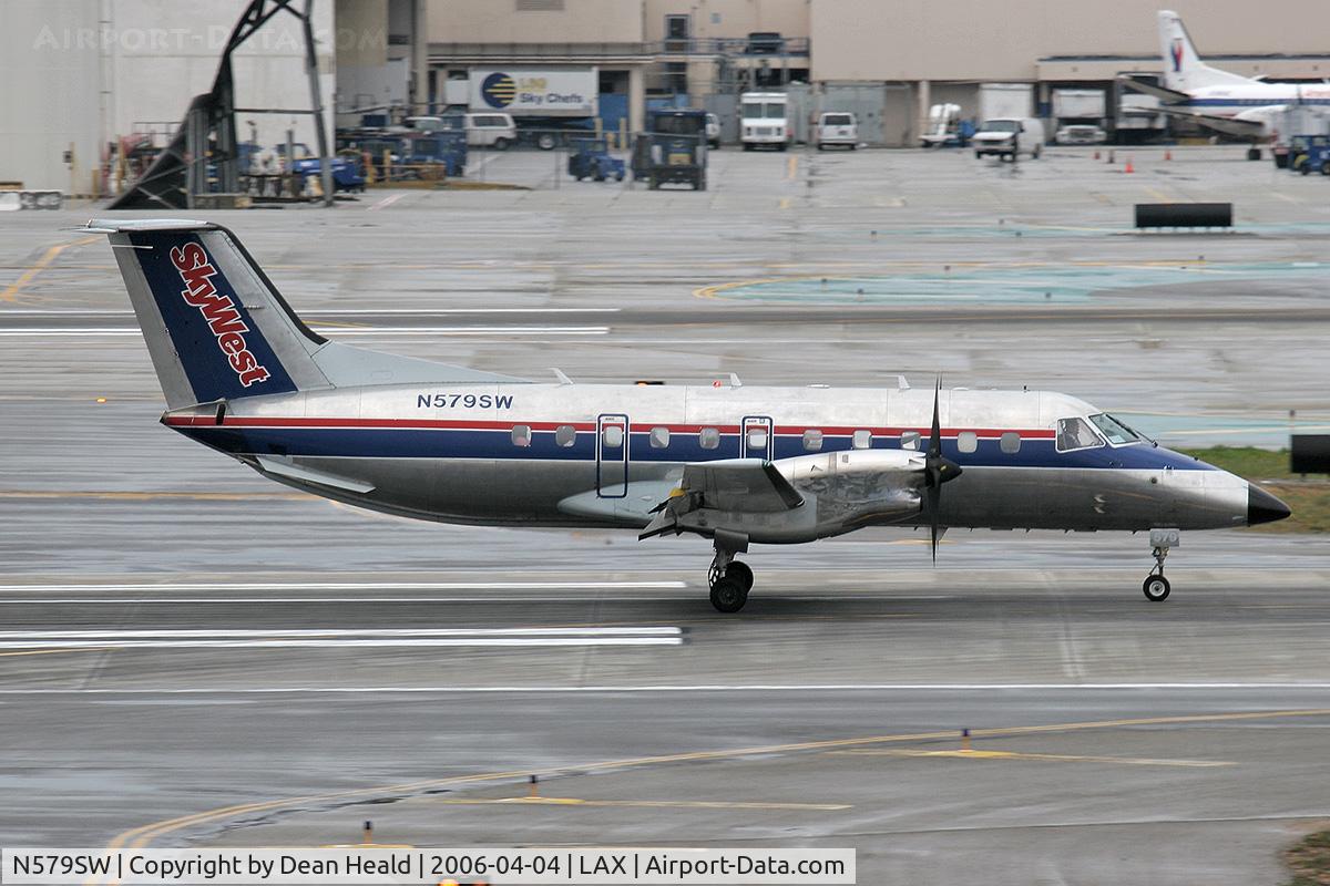 N579SW, 1998 Embraer EMB-120ER Brasilia C/N 120347, Skywest (FLT 6128) Embraer EMB-120 Brasilia rolling out on RWY 7R after arrival from Ontario Int'l (KONT), California.