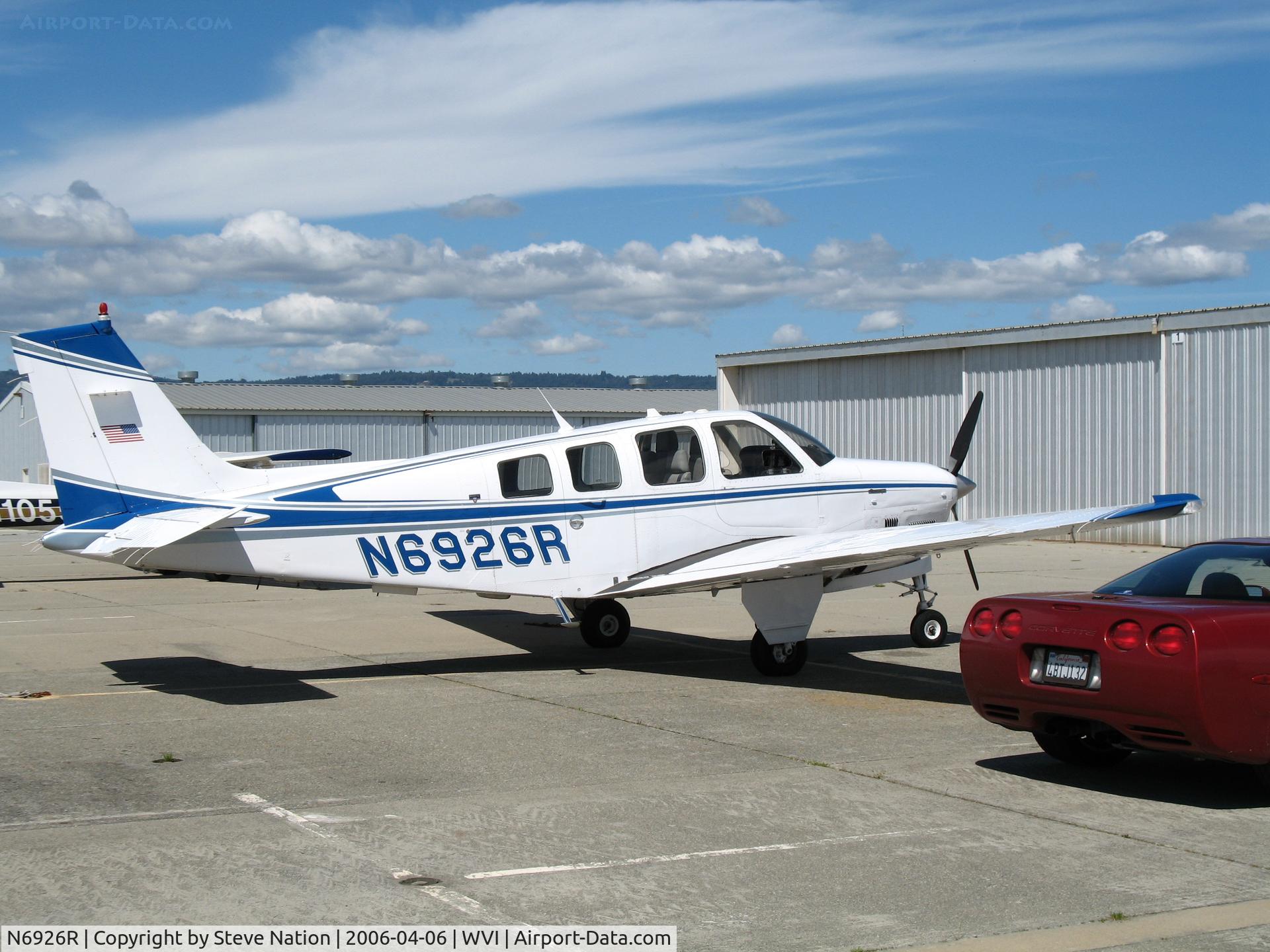 N6926R, 1984 Beech B36TC Bonanza C/N EA-436, 1984 Beech B36TC in late afternoon sun with red corvette @ Watsonville Municipal Airport, CA